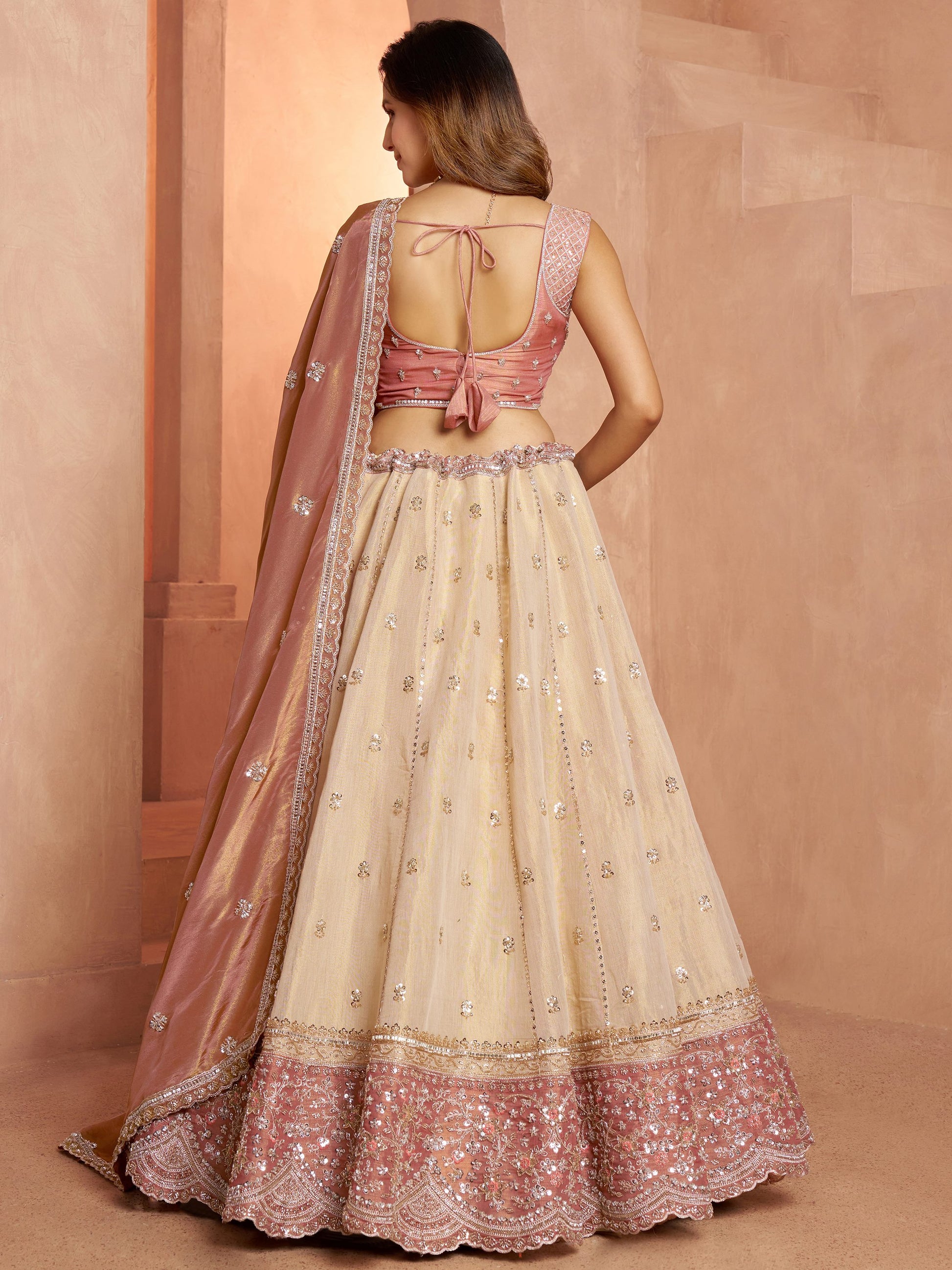Impressive Peach Sequins Tissue Wedding Wear Lehenga Choli With Dupatta