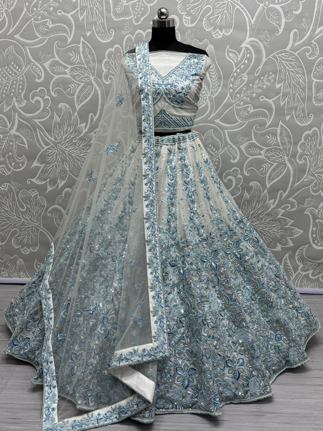 Enchanting Blue Multi Thread Work Net Bridesmaid Lehenga Choli With Dupatta