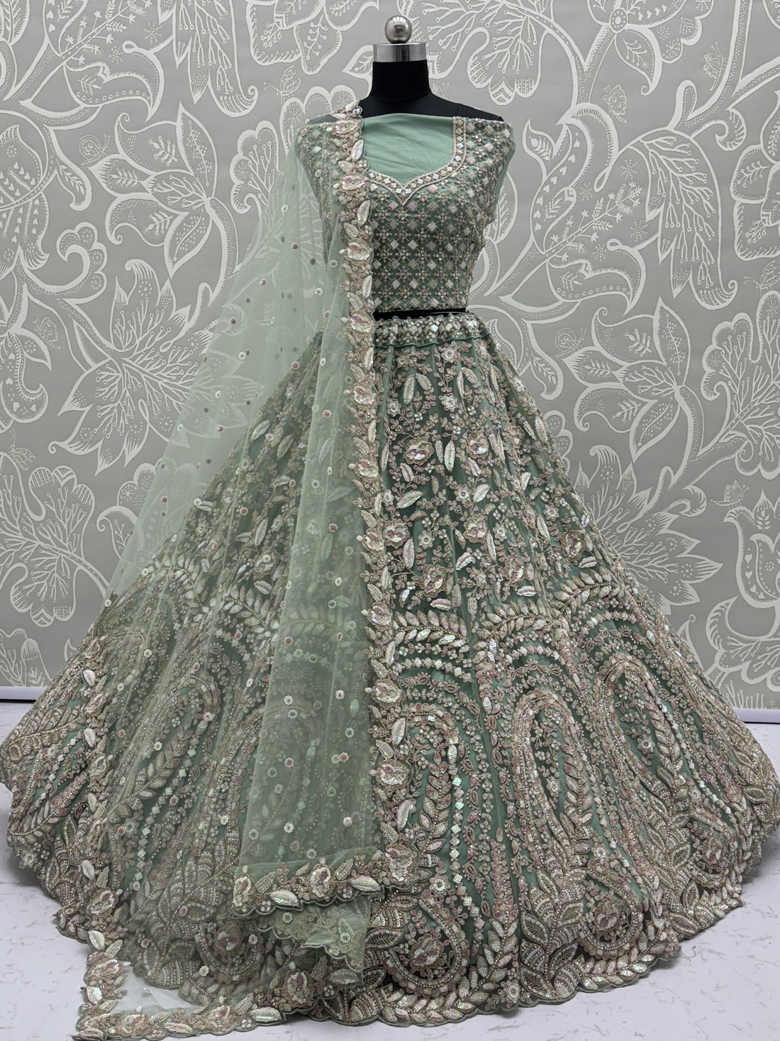Enchanting Pista Green Sequins Net Reception Wear Lehenga Choli With Dupatta