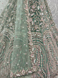Enchanting Pista Green Sequins Net Reception Wear Lehenga Choli With Dupatta