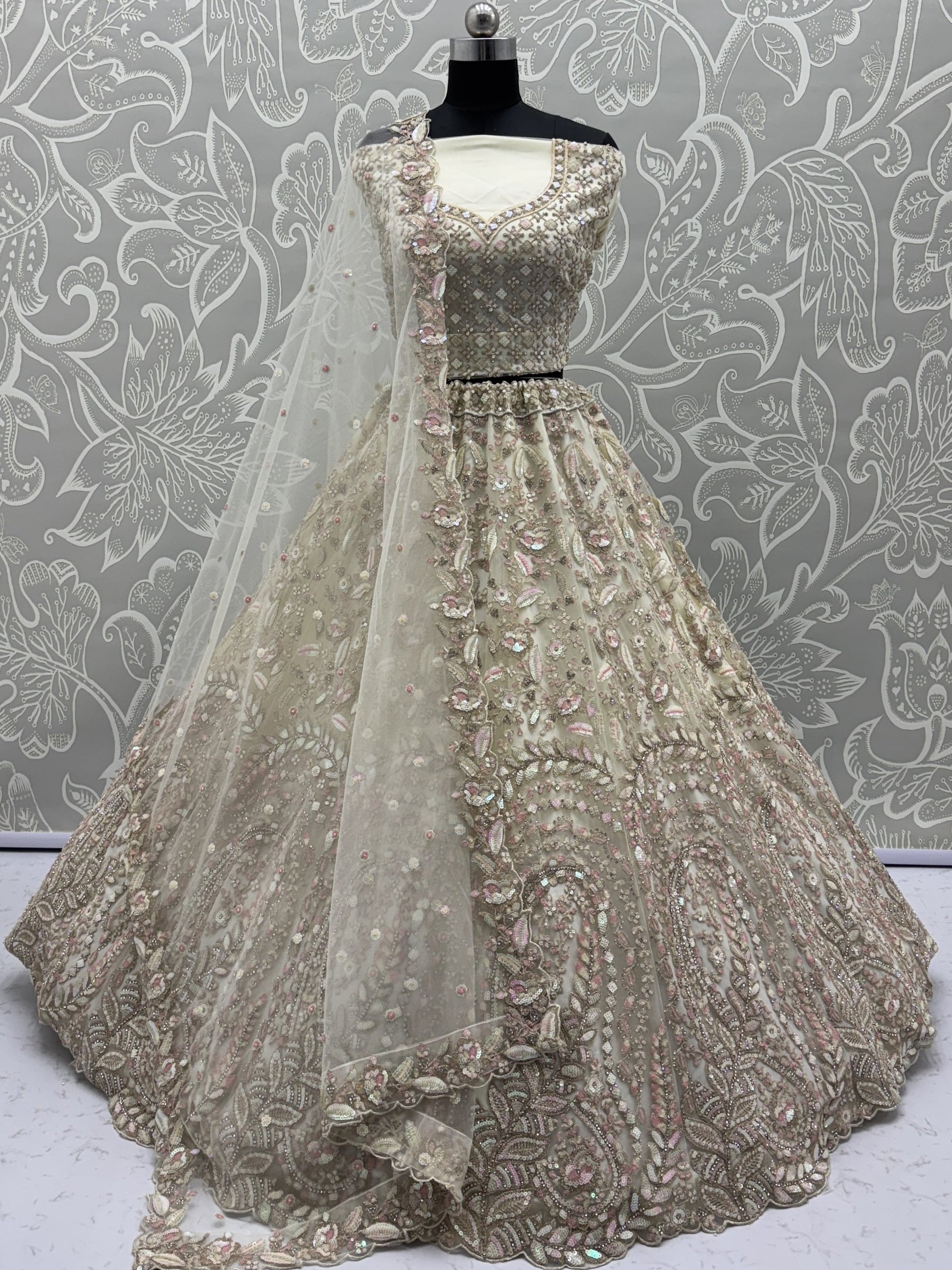 Charming Cream Zircon Work Net Bridesmaid Lehenga Choli With Dupatta