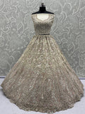 Charming Cream Zircon Work Net Bridesmaid Lehenga Choli With Dupatta