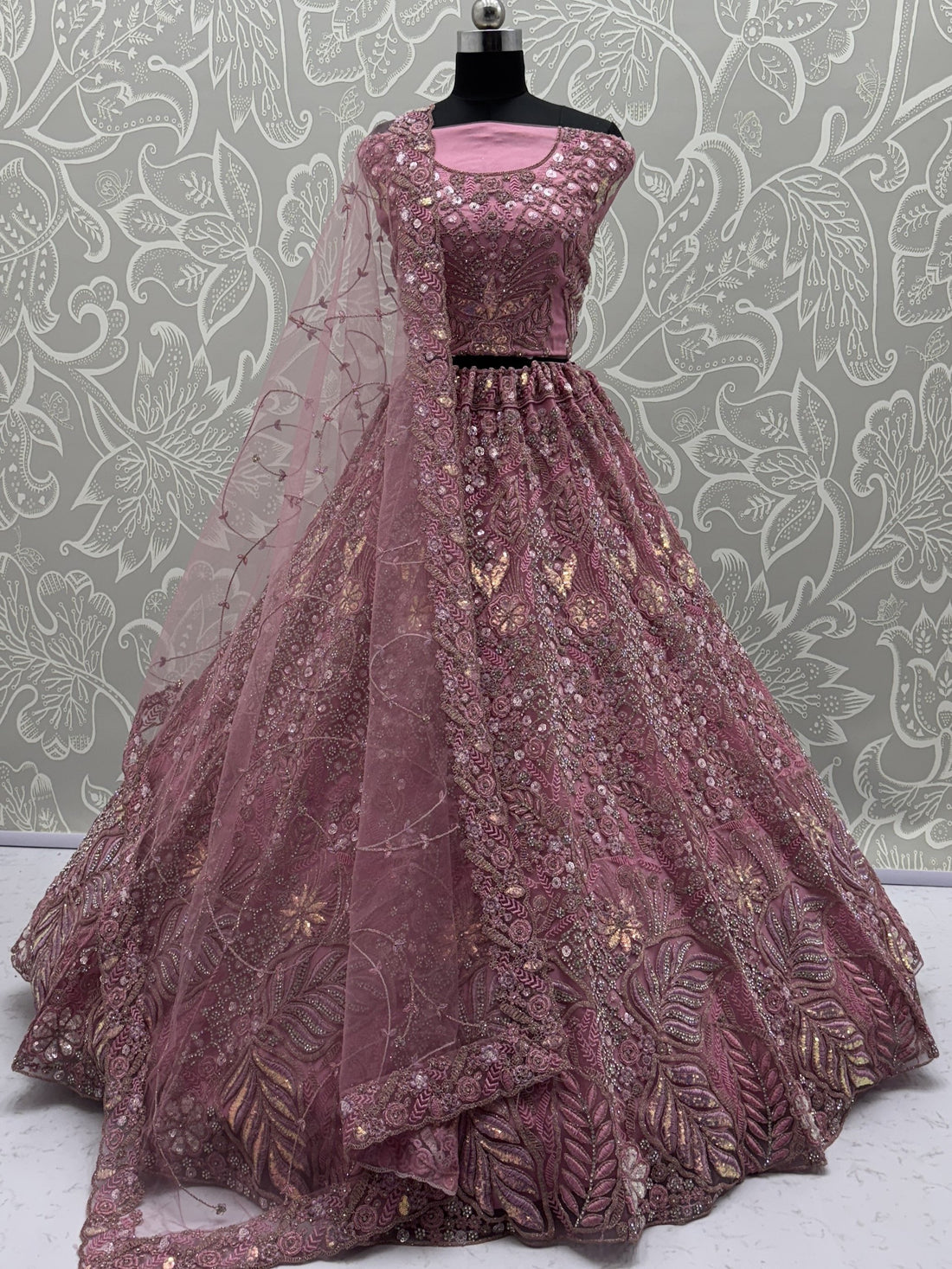Dazzling Pink Multi Thread Embroidery Net Reception Wear Lehenga Choli
