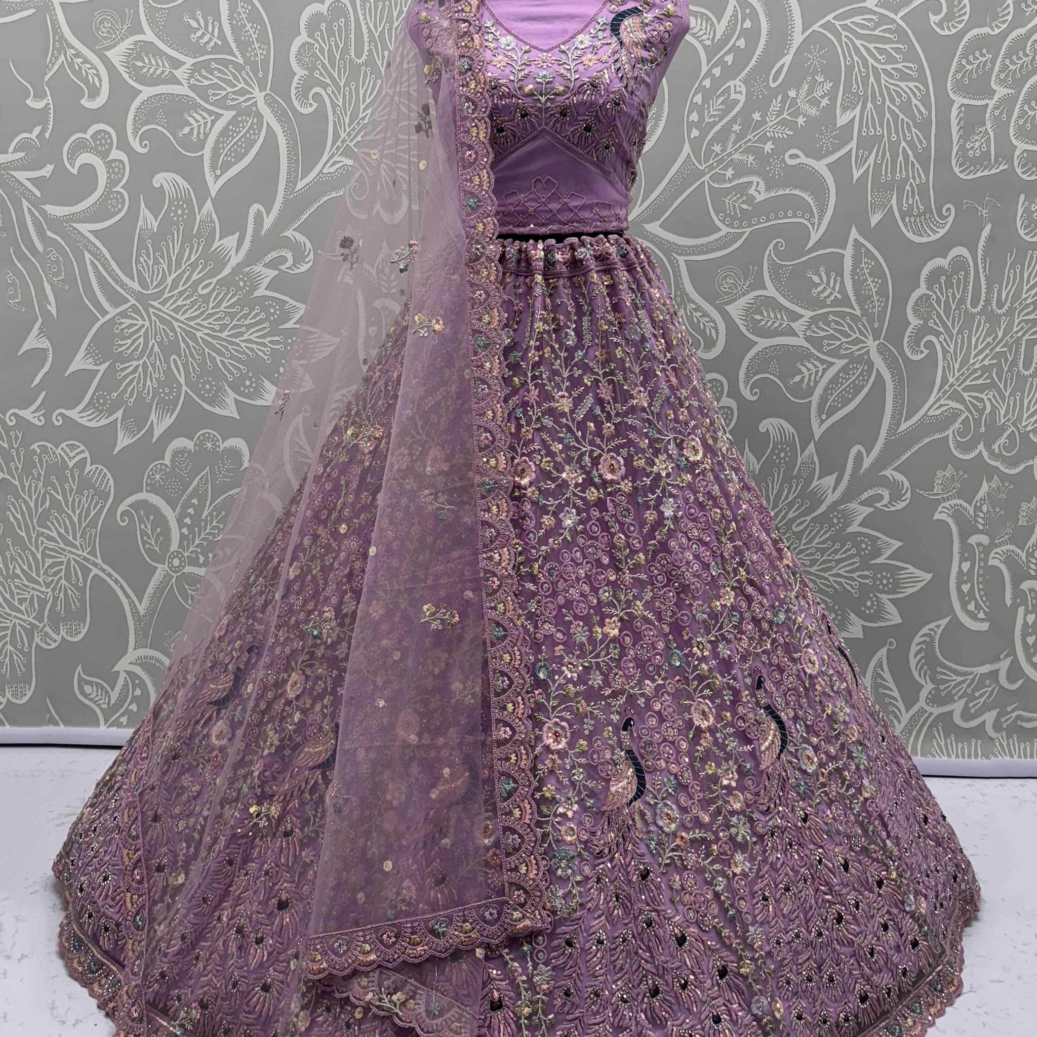 Astonishing Purple Zari Embroidered Net Engagement Wear Lehenga Choli