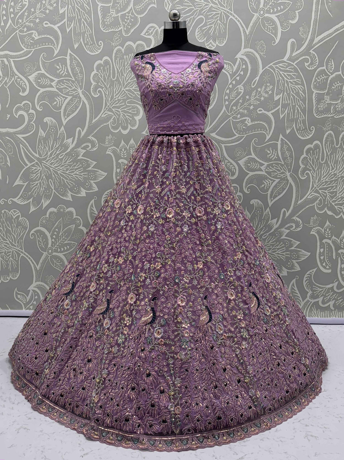 Astonishing Purple Zari Embroidered Net Engagement Wear Lehenga Choli