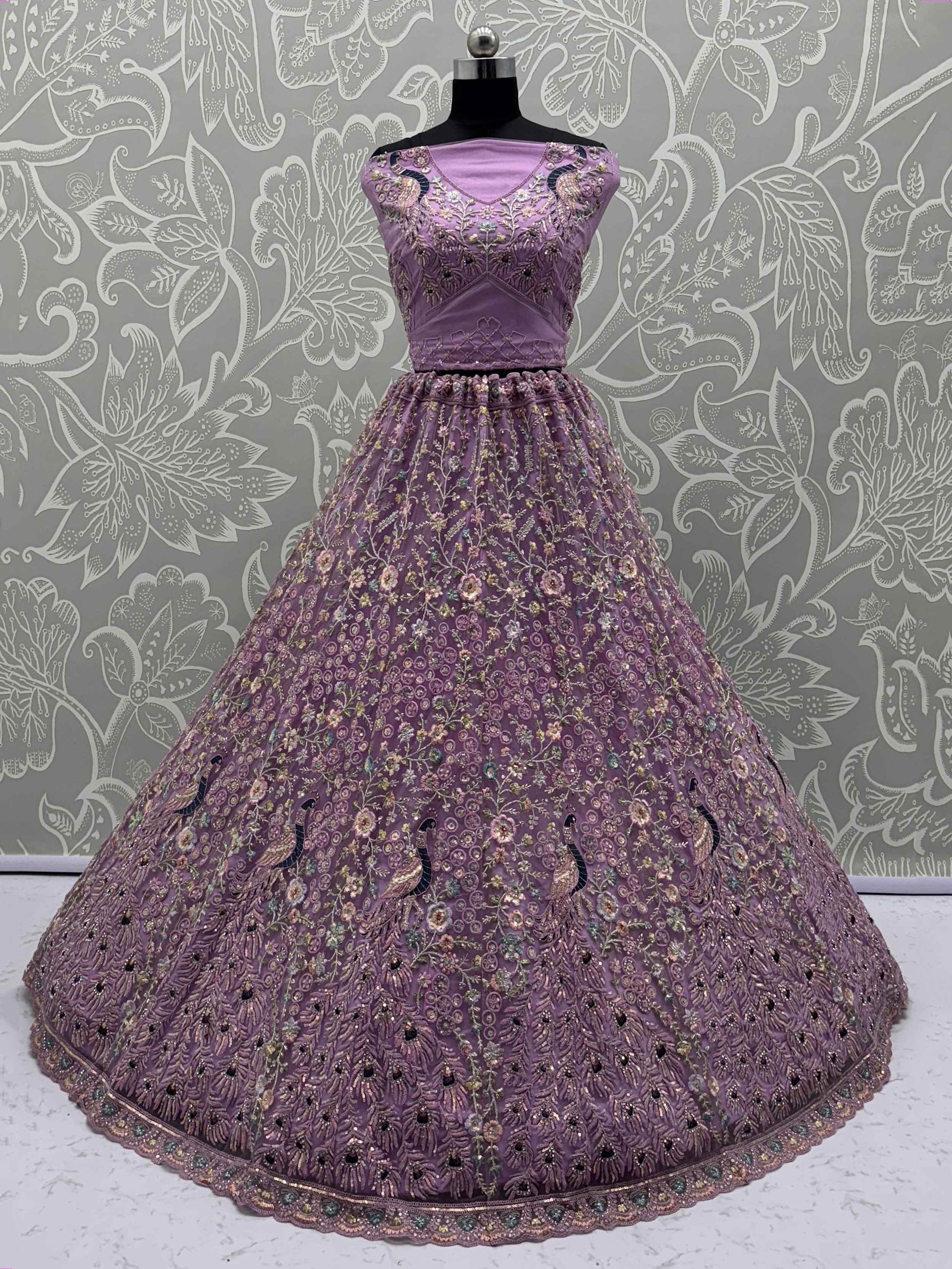 Astonishing Purple Zari Embroidered Net Engagement Wear Lehenga Choli