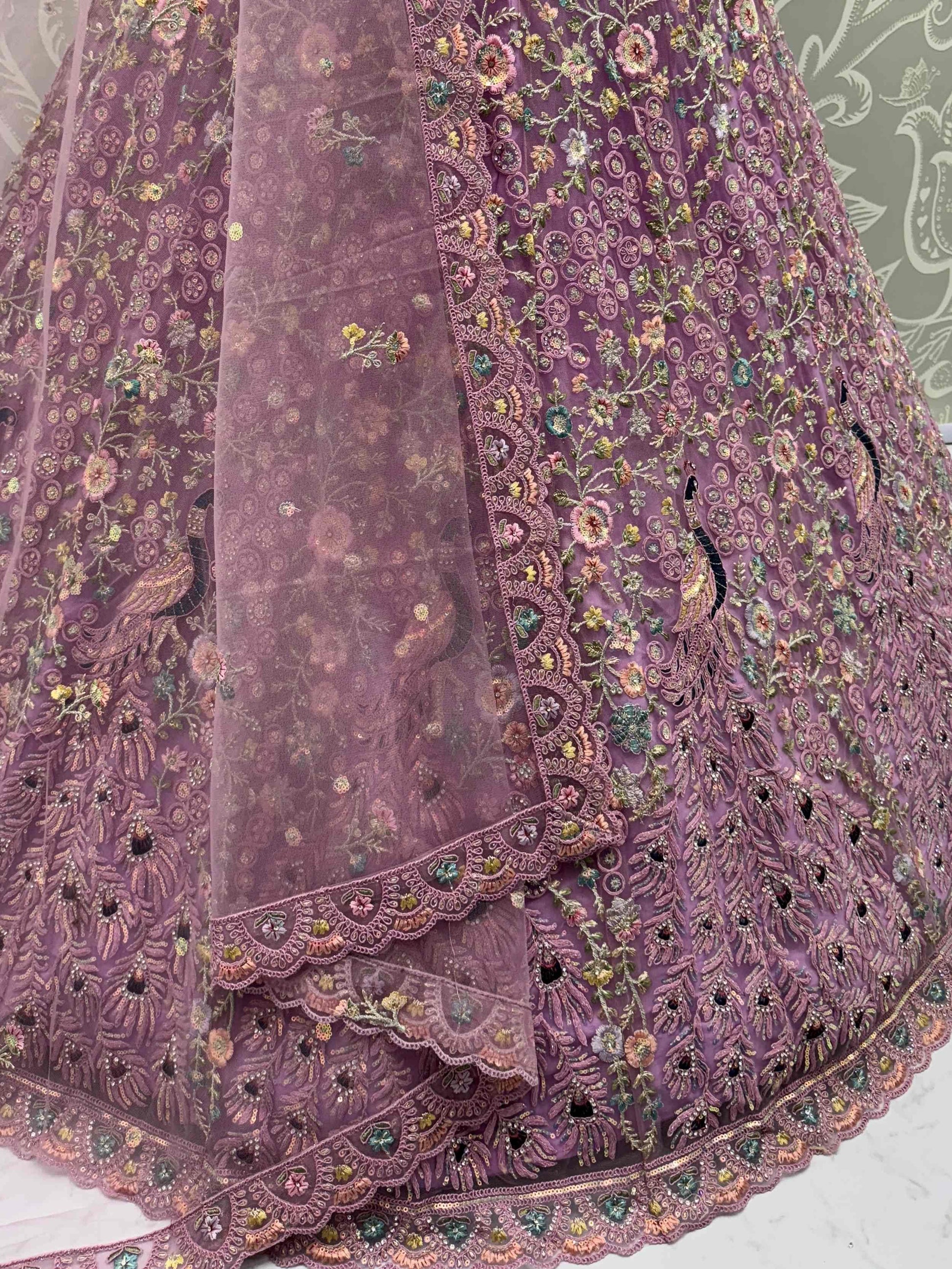 Astonishing Purple Zari Embroidered Net Engagement Wear Lehenga Choli