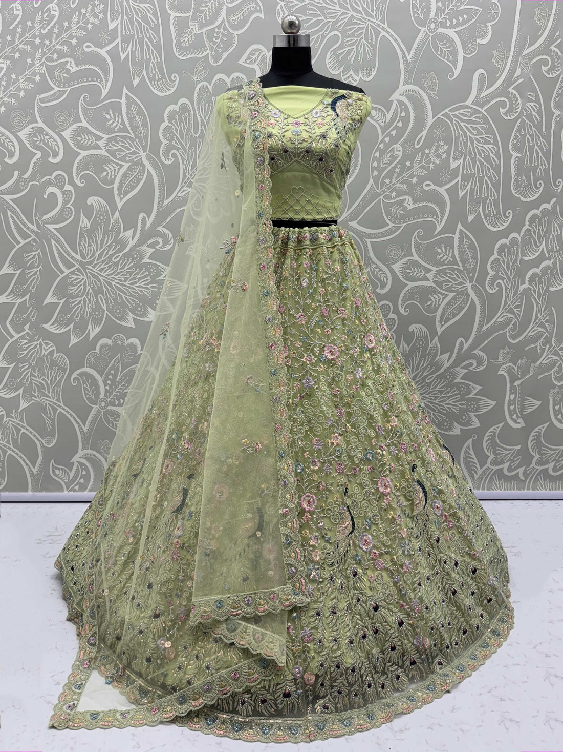 Pretty Green Zircon Work Net Sangeet Wear Lehenga Choli With Dupatta