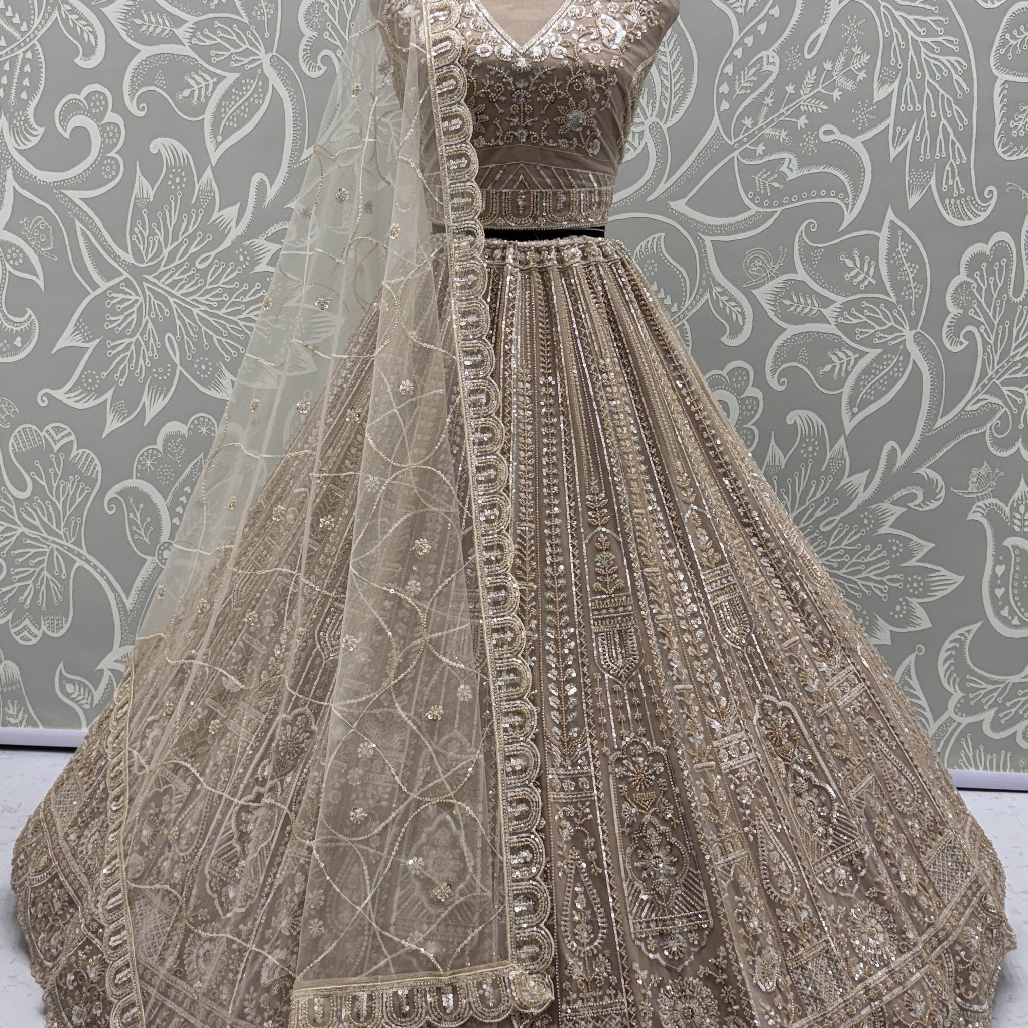 Enchanting Beige Embroidered Net Wedding Wear Lehenga Choli With Dupatta