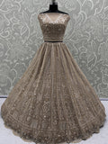 Enchanting Beige Embroidered Net Wedding Wear Lehenga Choli With Dupatta