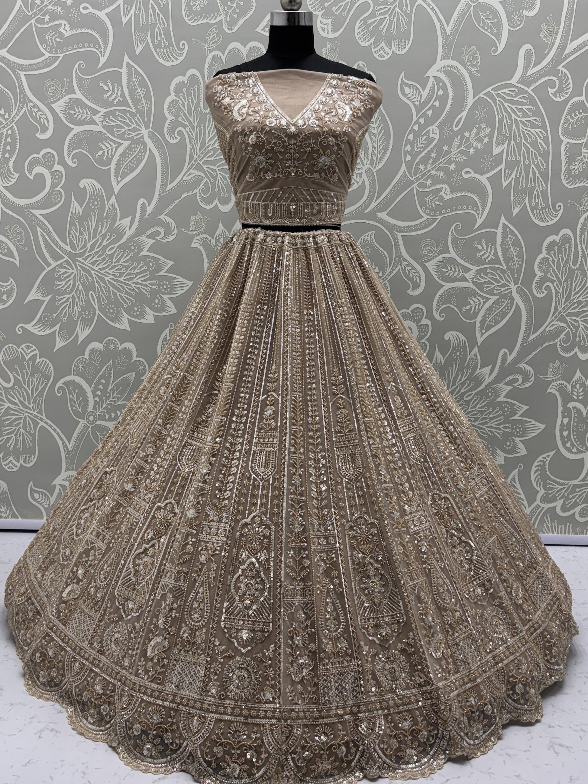 Enchanting Beige Embroidered Net Wedding Wear Lehenga Choli With Dupatta