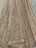 Enchanting Beige Embroidered Net Wedding Wear Lehenga Choli With Dupatta