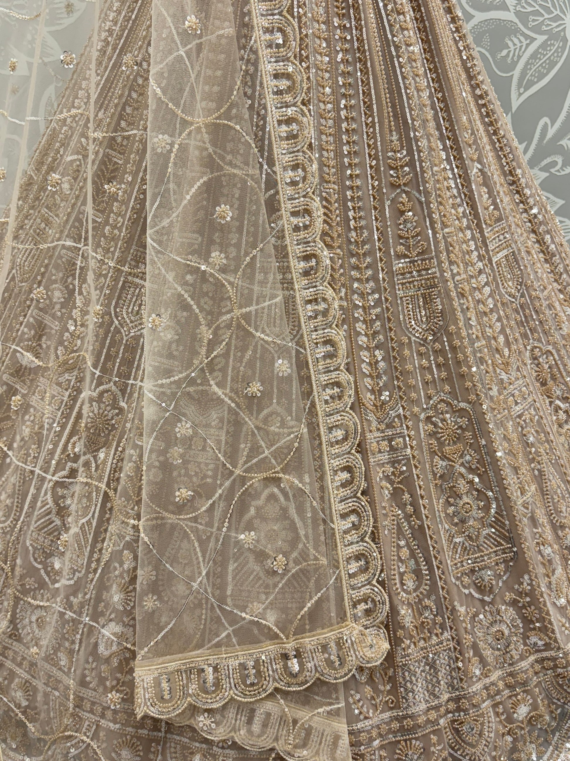 Enchanting Beige Embroidered Net Wedding Wear Lehenga Choli With Dupatta