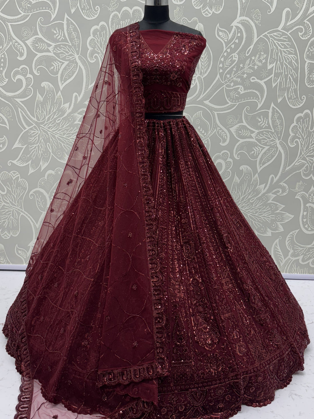 Stellar Maroon Thread Work Net Bridal Lehenga Choli With Dupatta