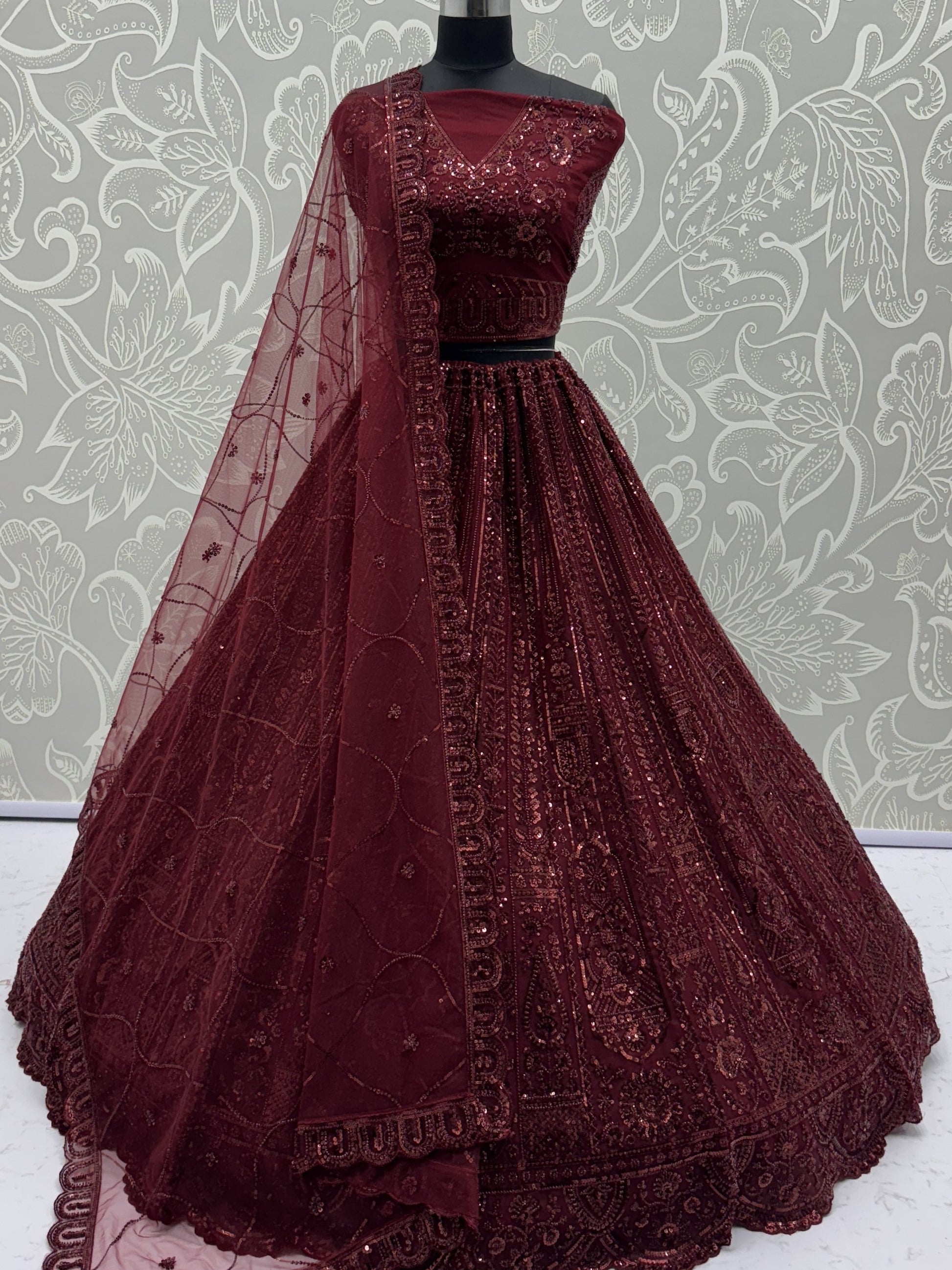 Stellar Maroon Thread Work Net Bridal Lehenga Choli With Dupatta