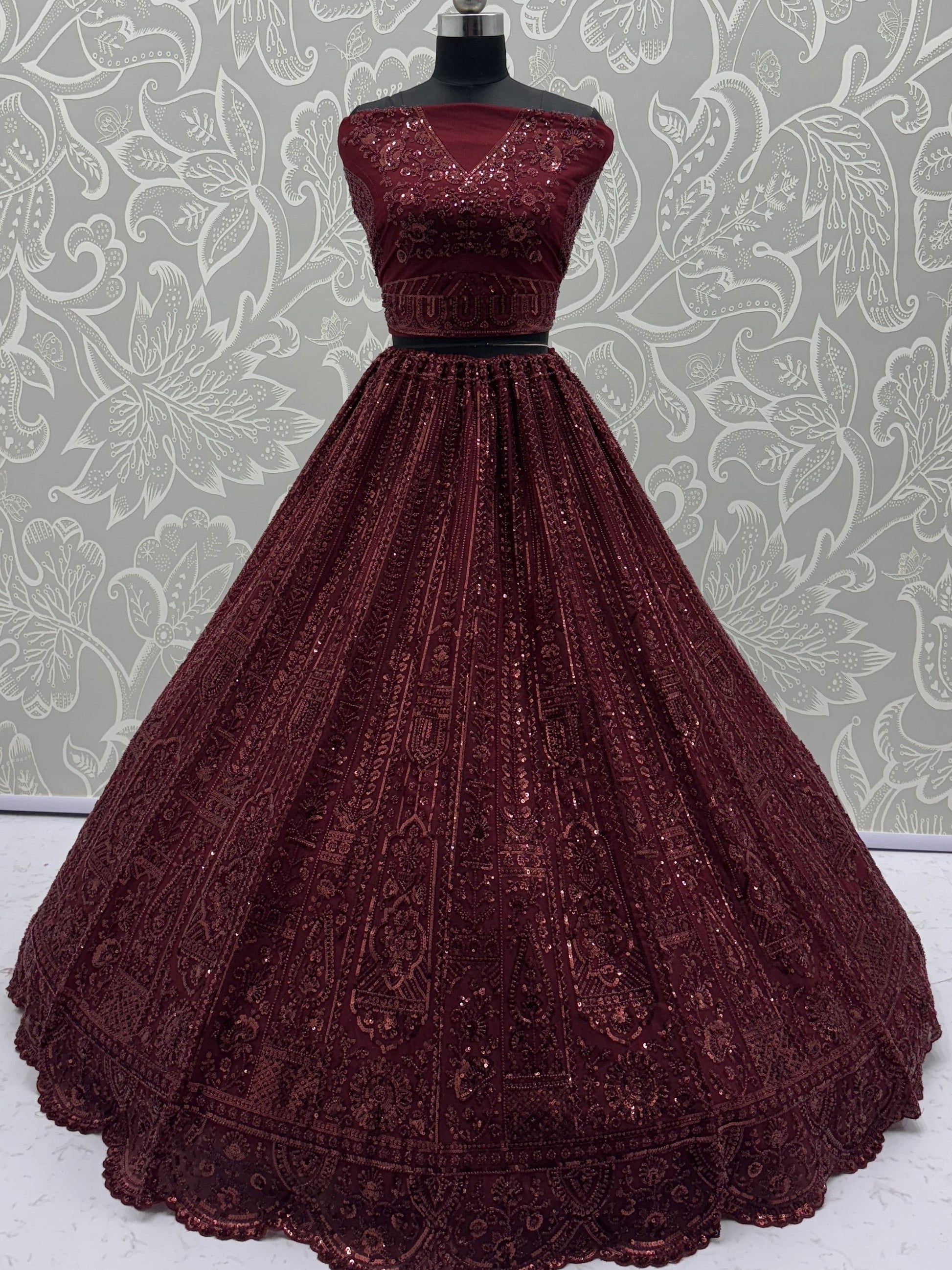 Stellar Maroon Thread Work Net Bridal Lehenga Choli With Dupatta