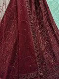 Stellar Maroon Thread Work Net Bridal Lehenga Choli With Dupatta