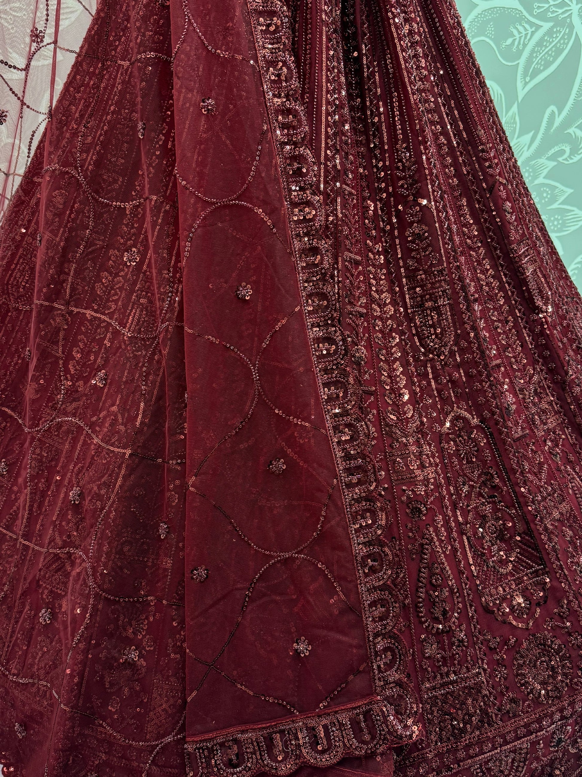 Stellar Maroon Thread Work Net Bridal Lehenga Choli With Dupatta
