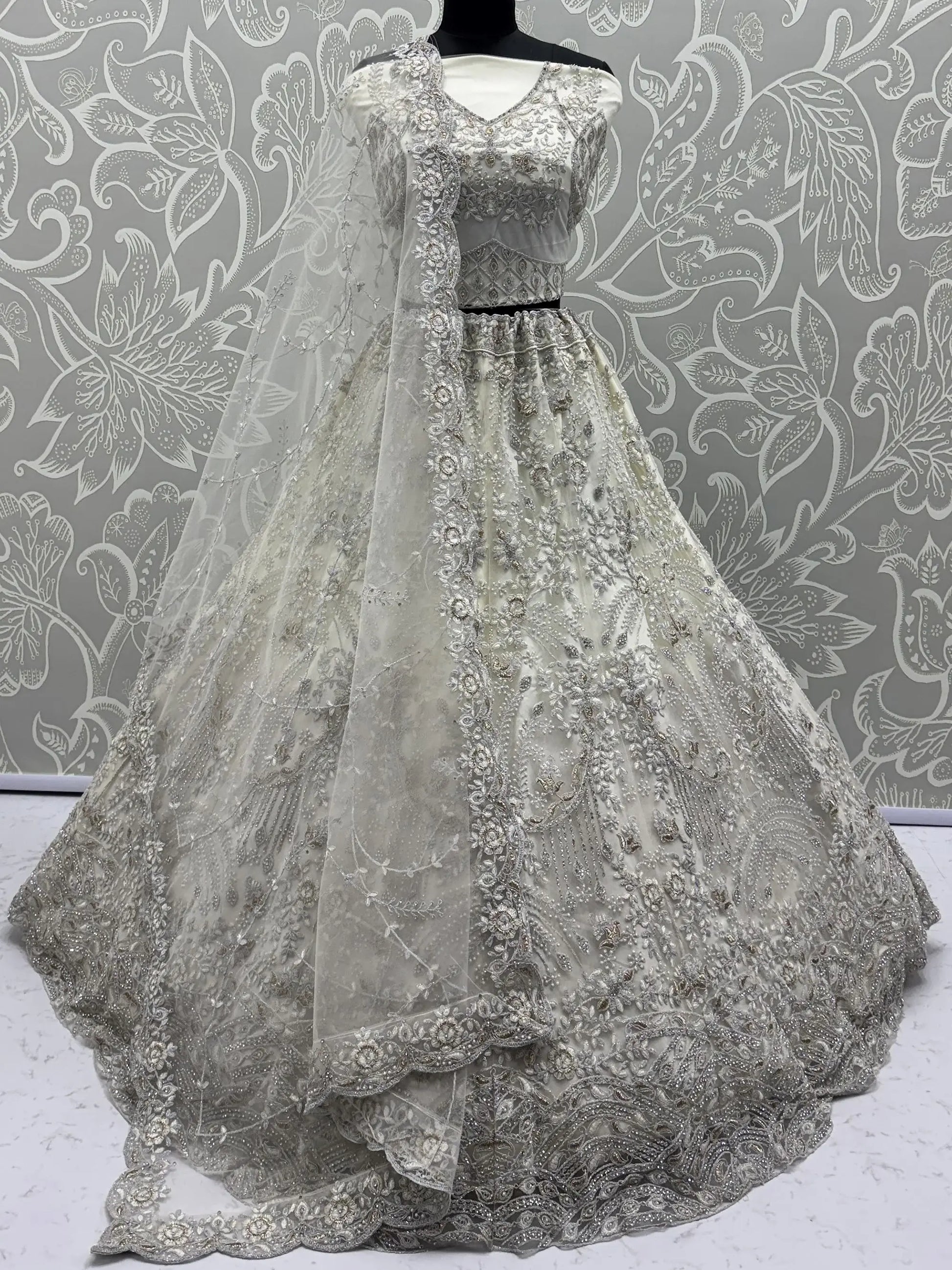 Stunning White Zari Embroidered Net Sangeet Wear Lehenga Choli With Dupatta