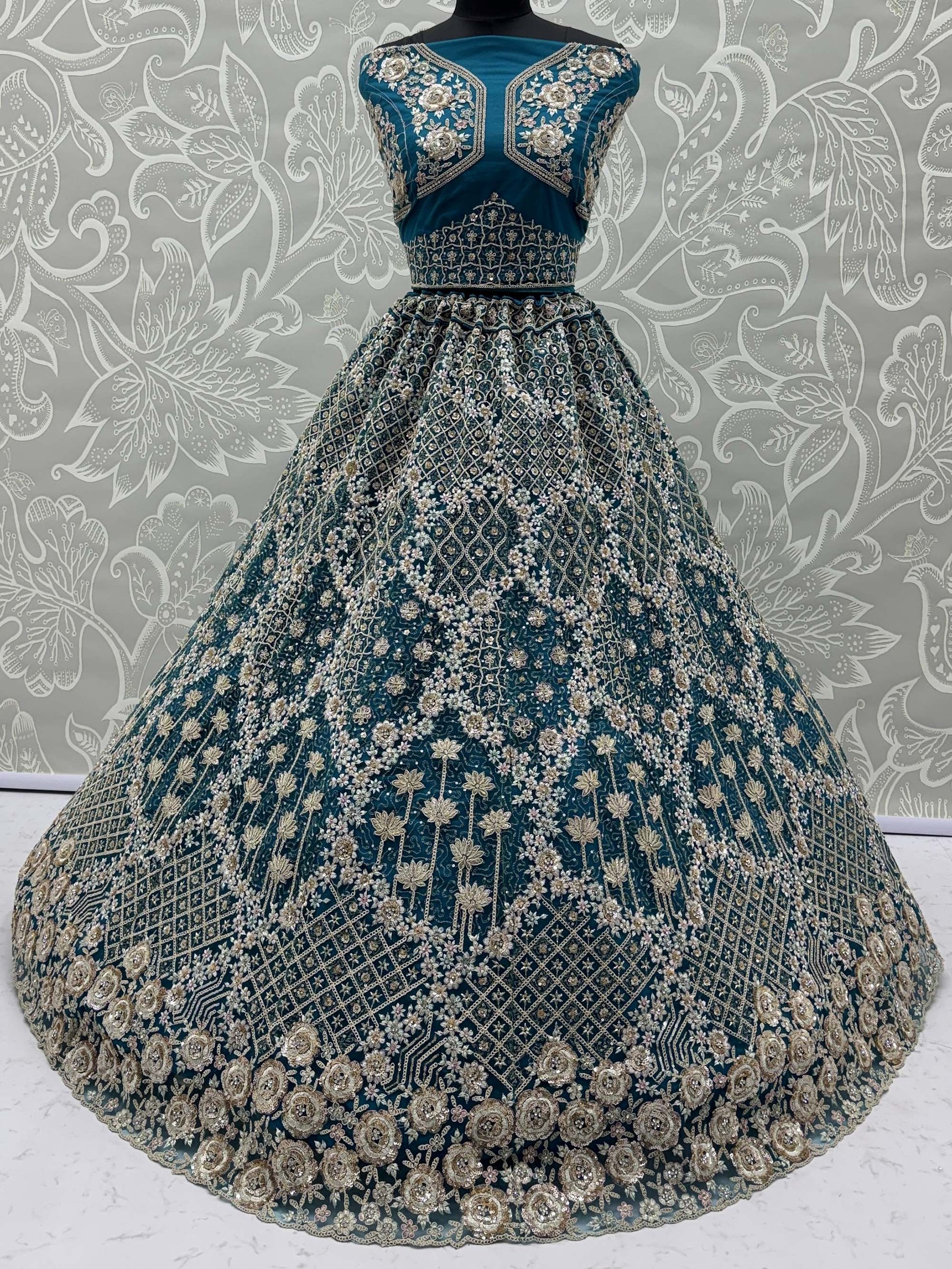 Elegant Teal Blue Net Floral Embroidery Sangeet Wear Lehenga Choli