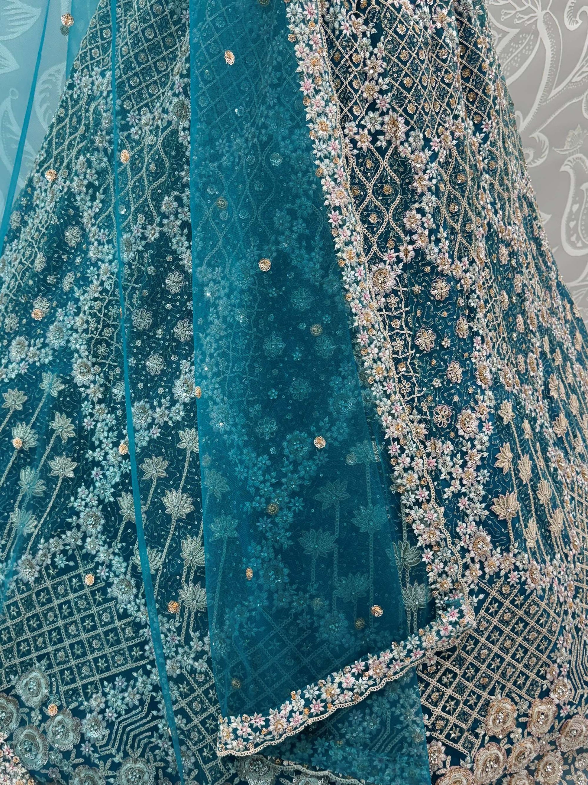 Elegant Teal Blue Net Floral Embroidery Sangeet Wear Lehenga Choli