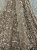 Sparkling Beige Thread Embroidered Net Sangeet Wear Lehenga Choli