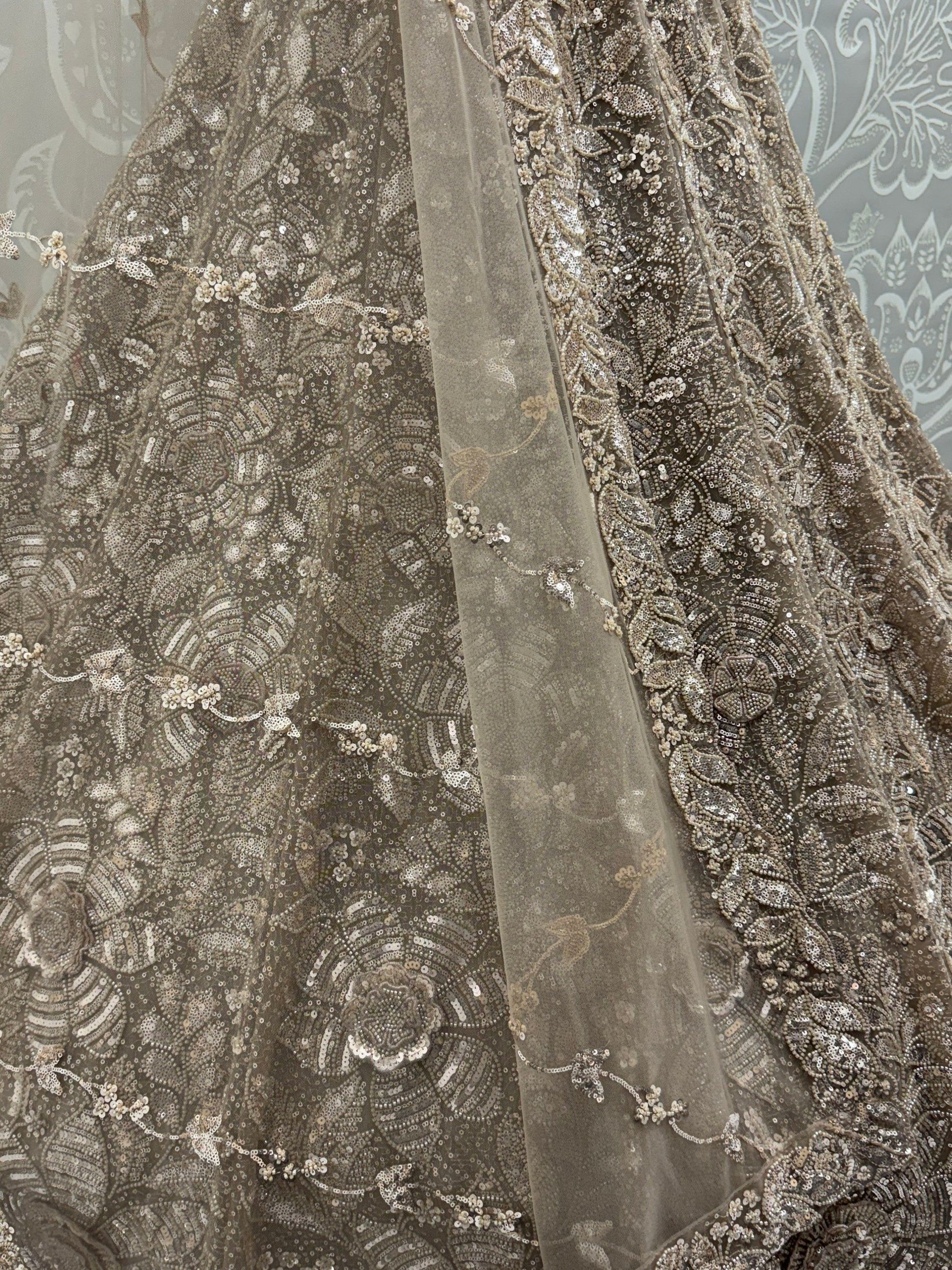 Sparkling Beige Thread Embroidered Net Sangeet Wear Lehenga Choli