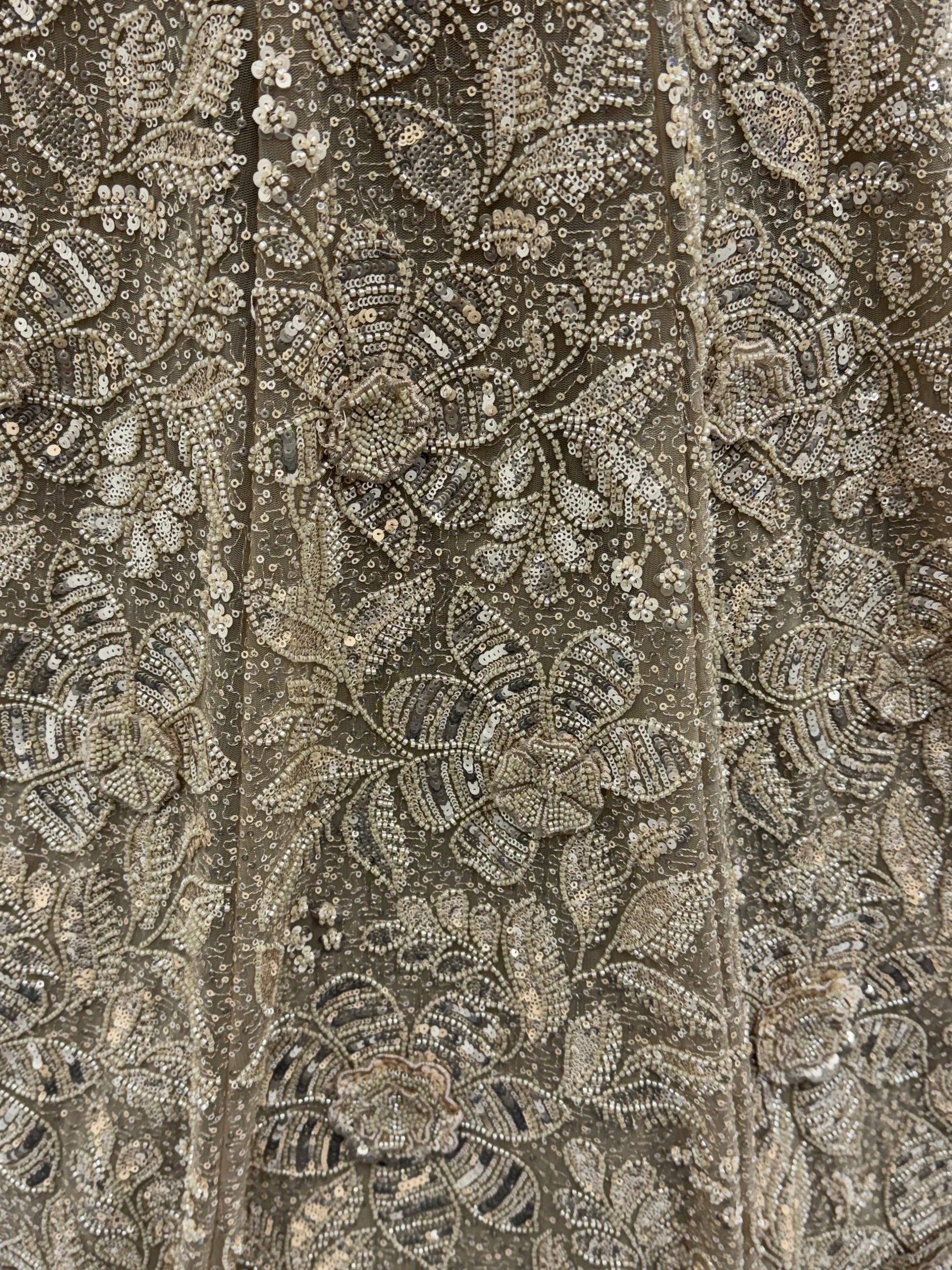 Sparkling Beige Thread Embroidered Net Sangeet Wear Lehenga Choli