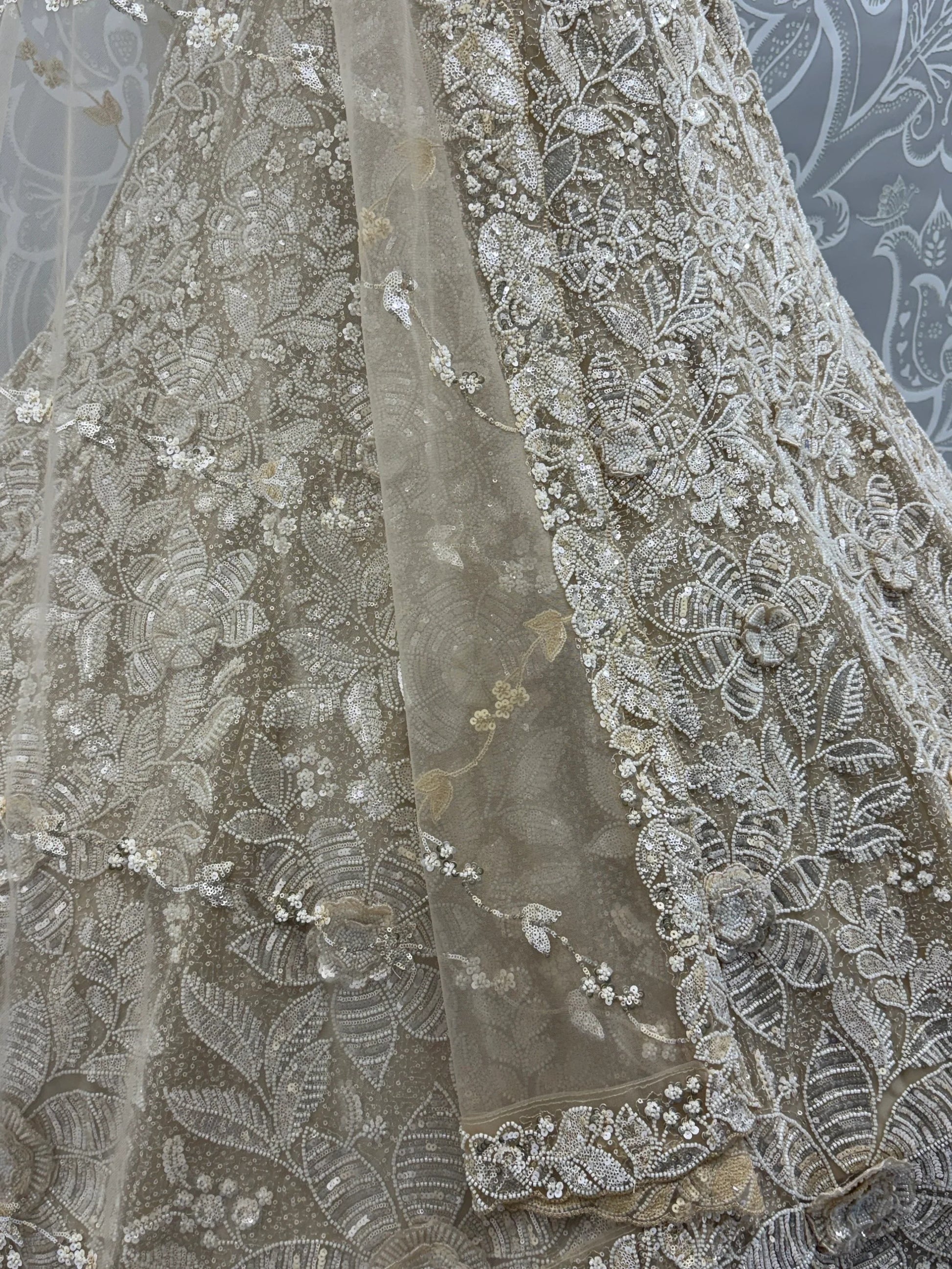 Phenomenal Cream Thread Embroidered Net Reception Wear Lehenga Choli