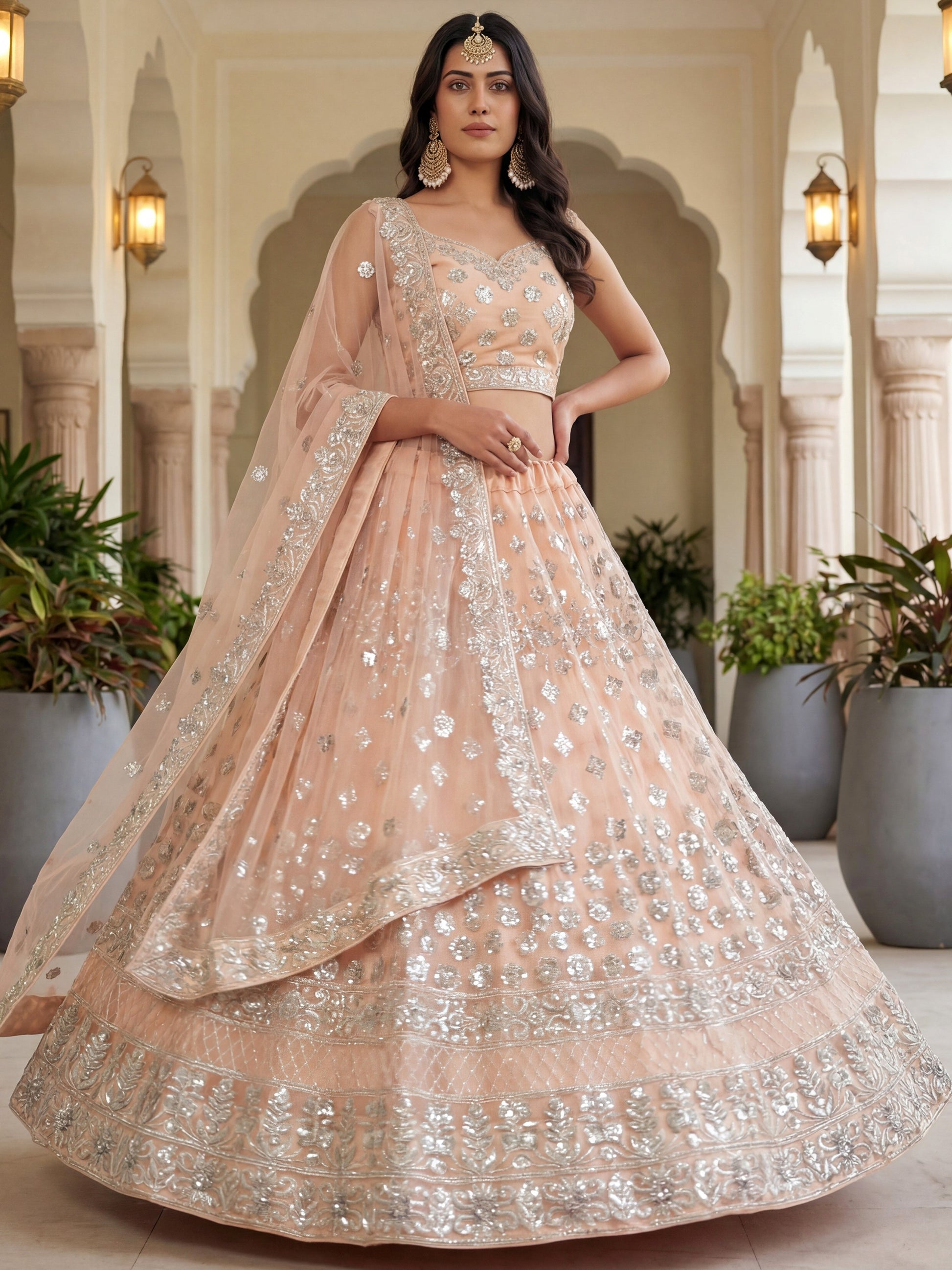 Glamorous Peach Zari Work Net Engagement Wear Lehenga Choli