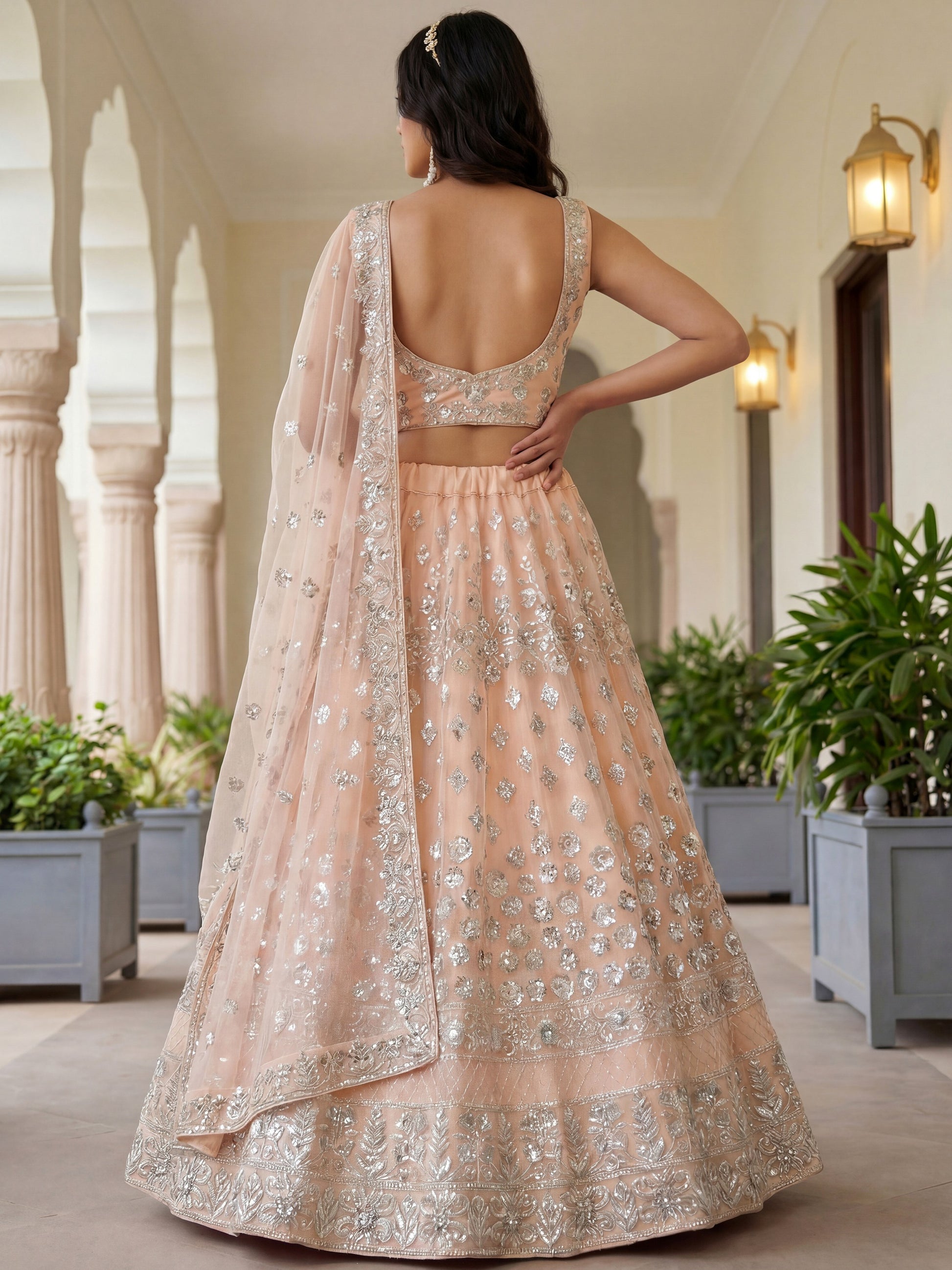 Glamorous Peach Zari Work Net Engagement Wear Lehenga Choli