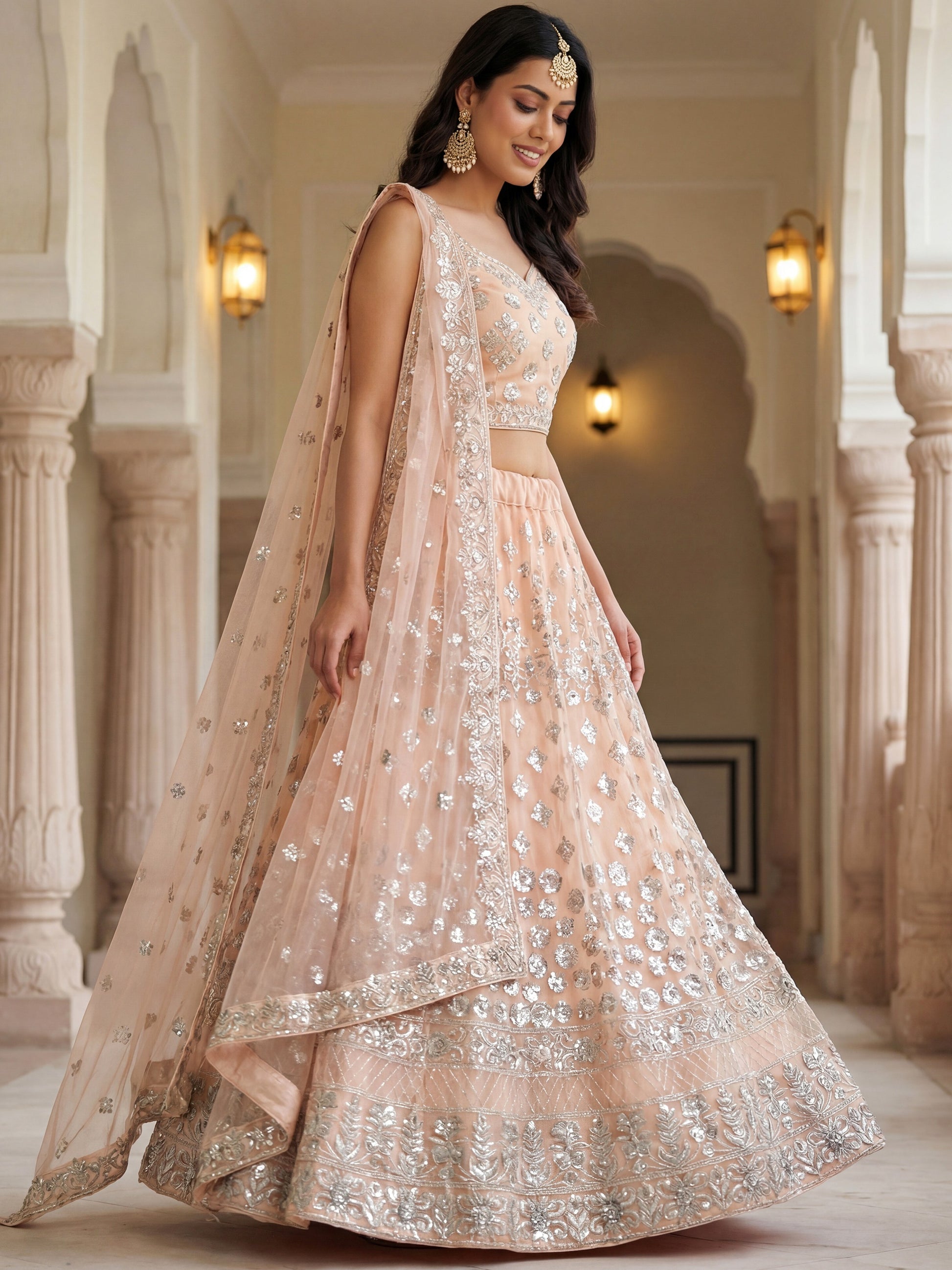 Glamorous Peach Zari Work Net Engagement Wear Lehenga Choli