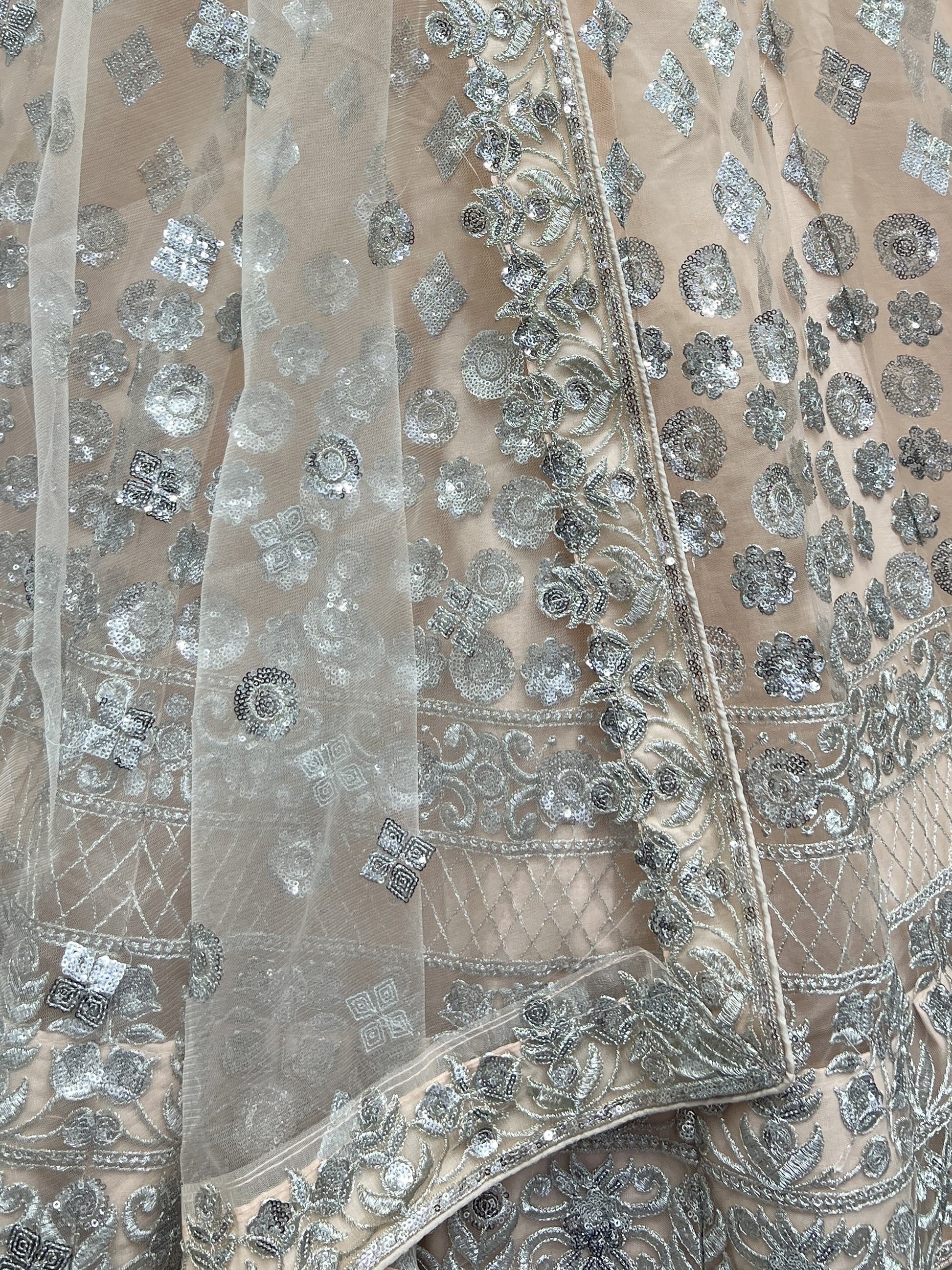 Glamorous Peach Zari Work Net Engagement Wear Lehenga Choli