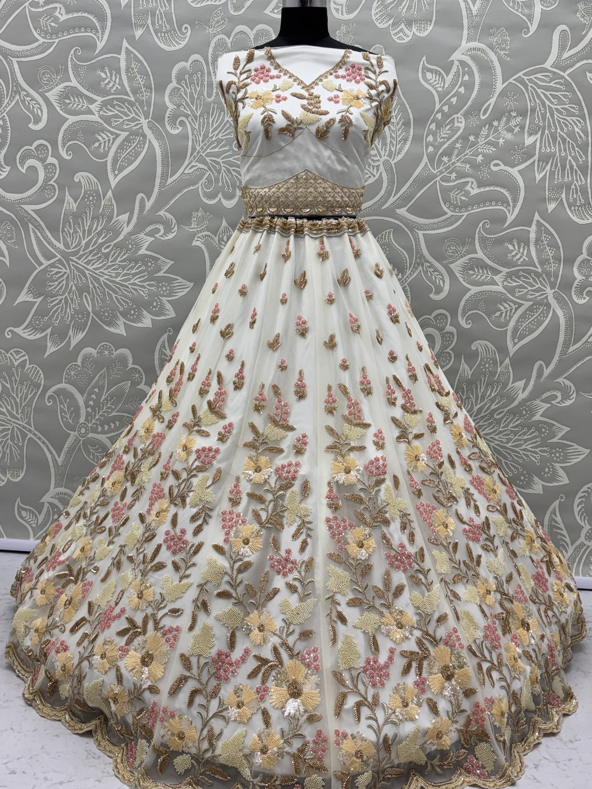 Astonishing White Hand Embroidered Net Reception Wear Lehenga Choli