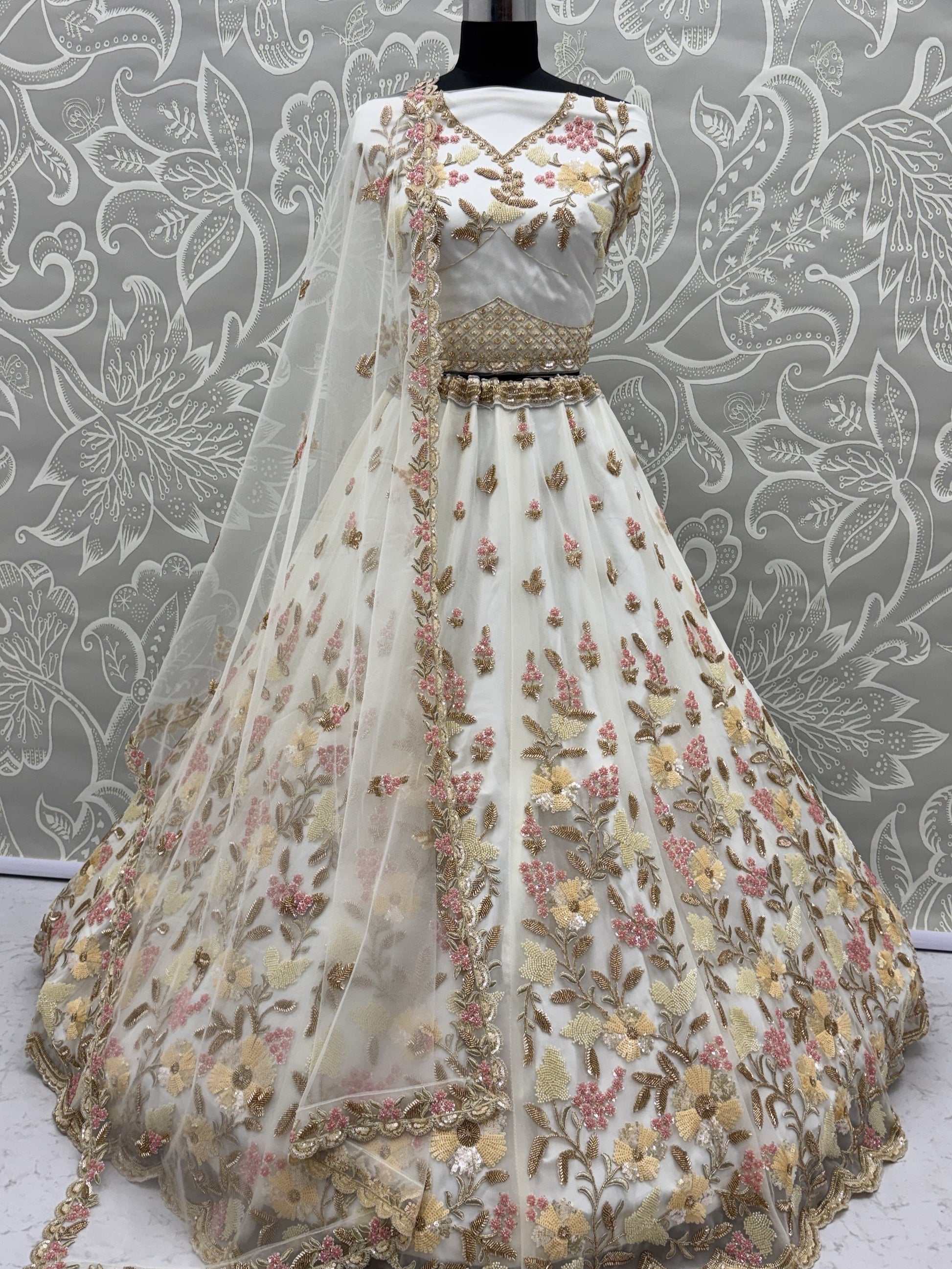 Astonishing White Hand Embroidered Net Reception Wear Lehenga Choli