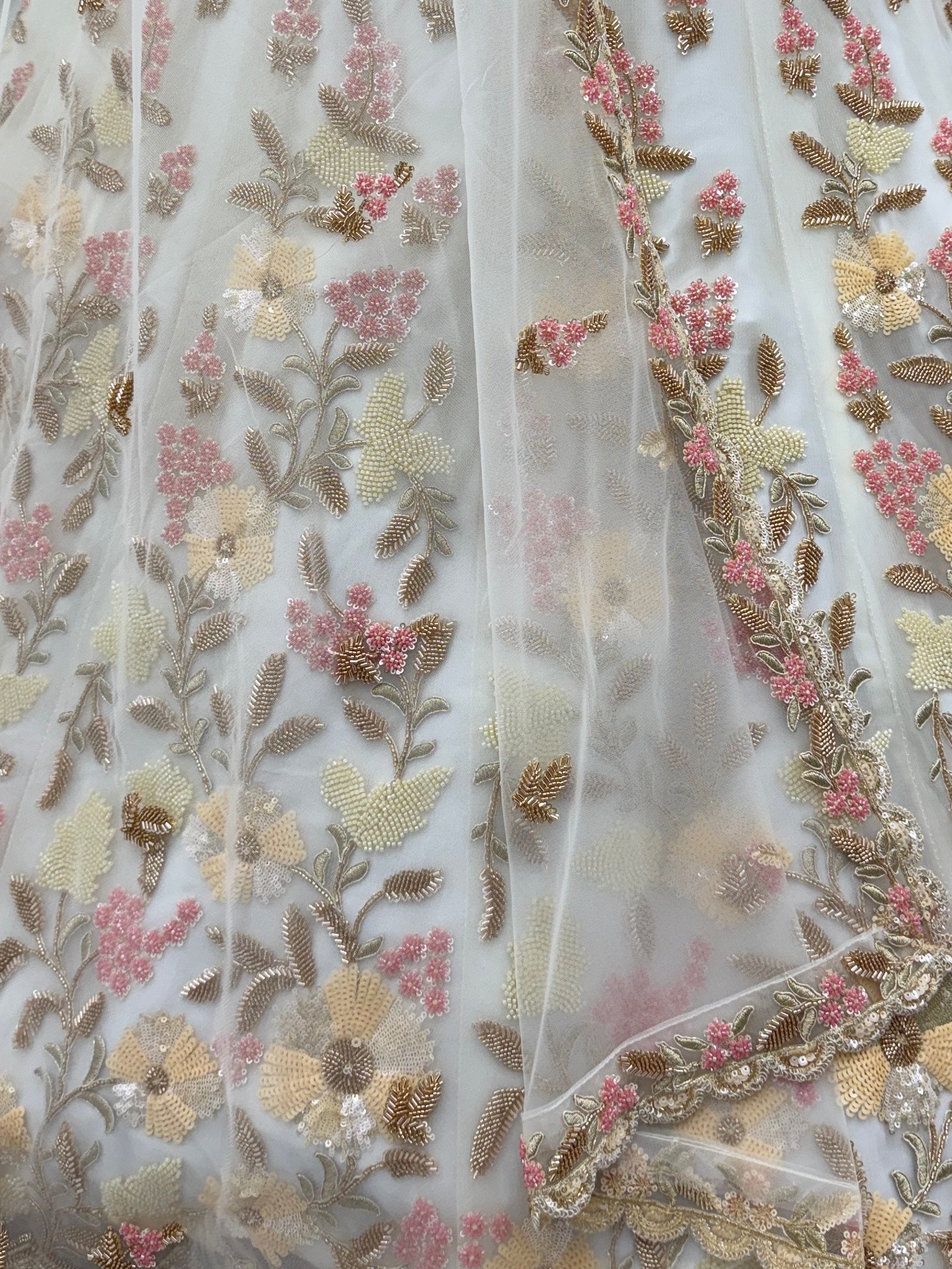 Astonishing White Hand Embroidered Net Reception Wear Lehenga Choli