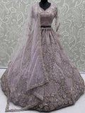Sparkling Lavender Embroidery Net Wedding Wear Lehenga Choli with Dupatta