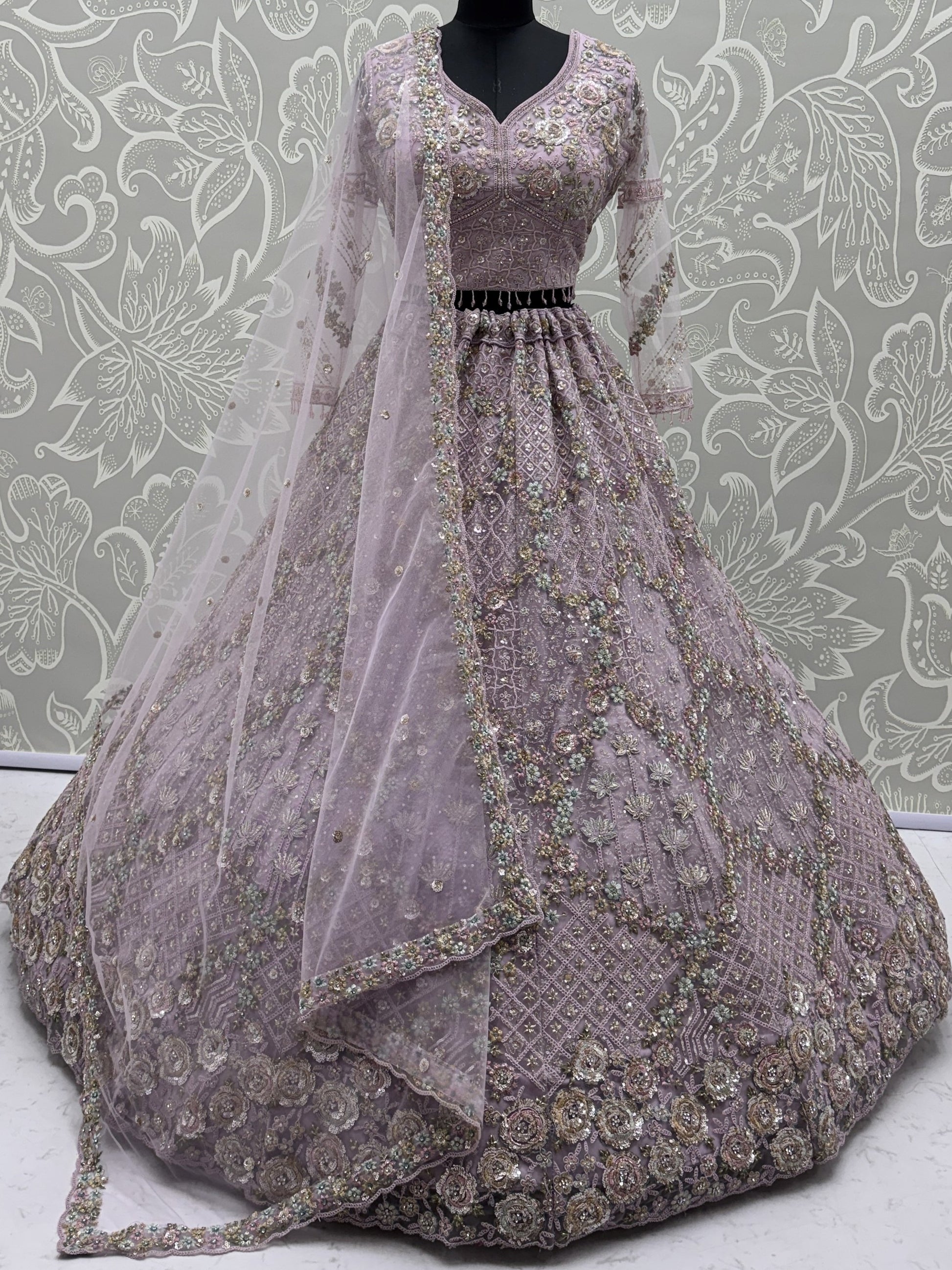 Sparkling Lavender Embroidery Net Wedding Wear Lehenga Choli with Dupatta