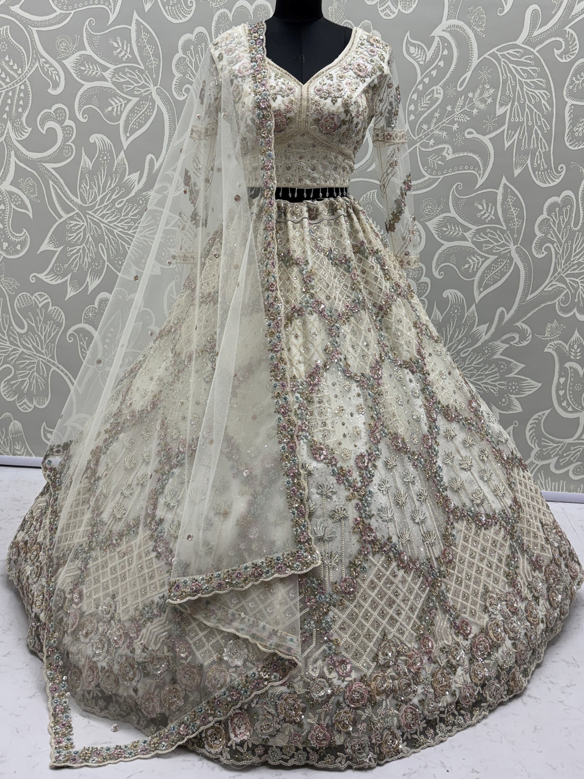 Glowing Off-White Embroidery Net Reception Wear Lehenga Choli with Dupatta