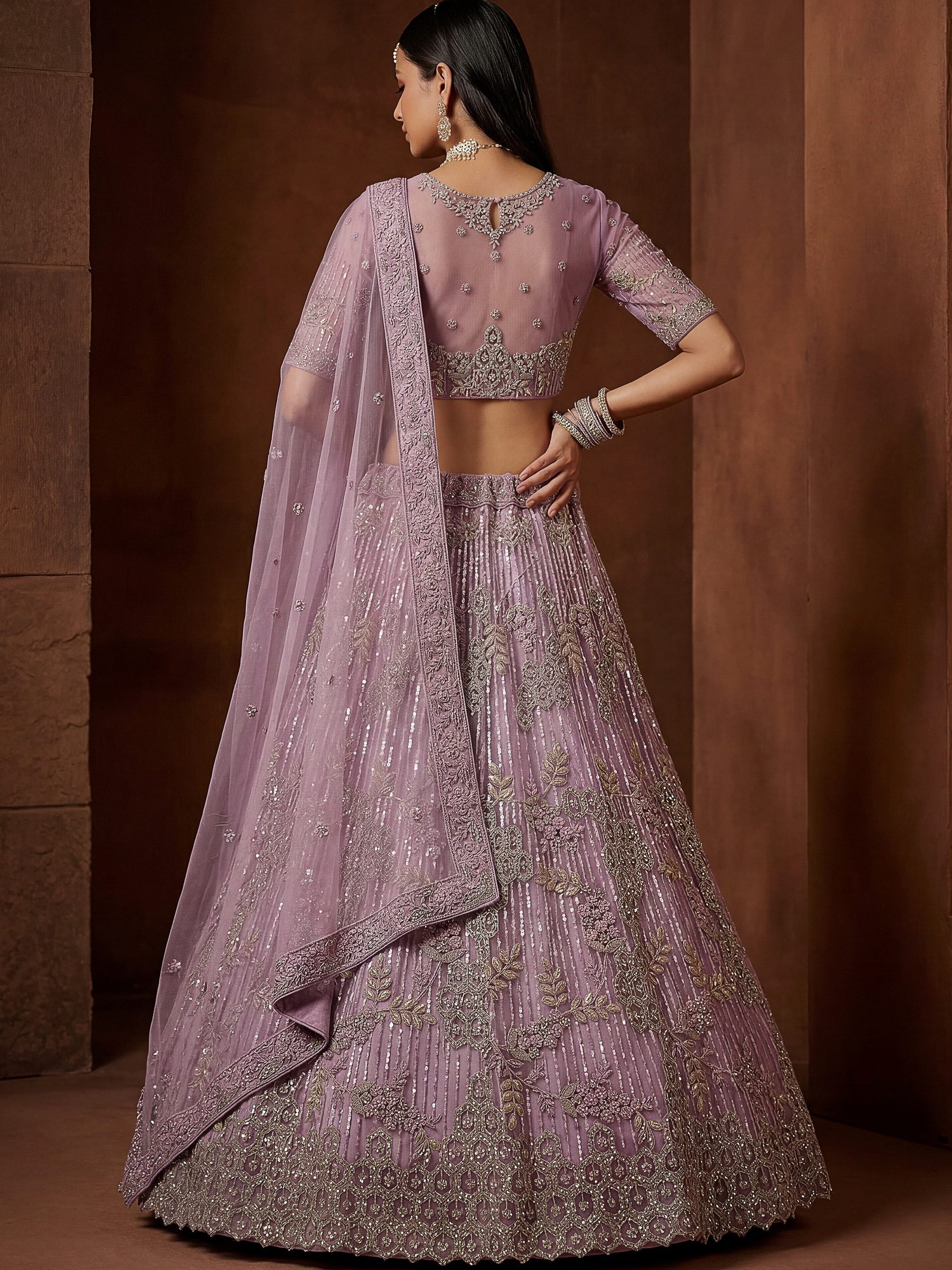 Attractive Lavender Zari Embroidered Net Wedding Wear Lehenga Choli