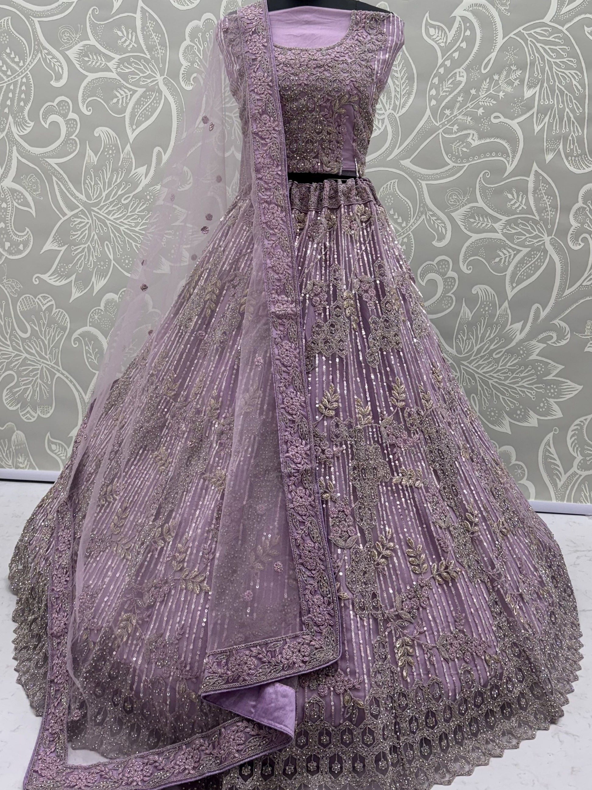 Attractive Lavender Zari Embroidered Net Wedding Wear Lehenga Choli