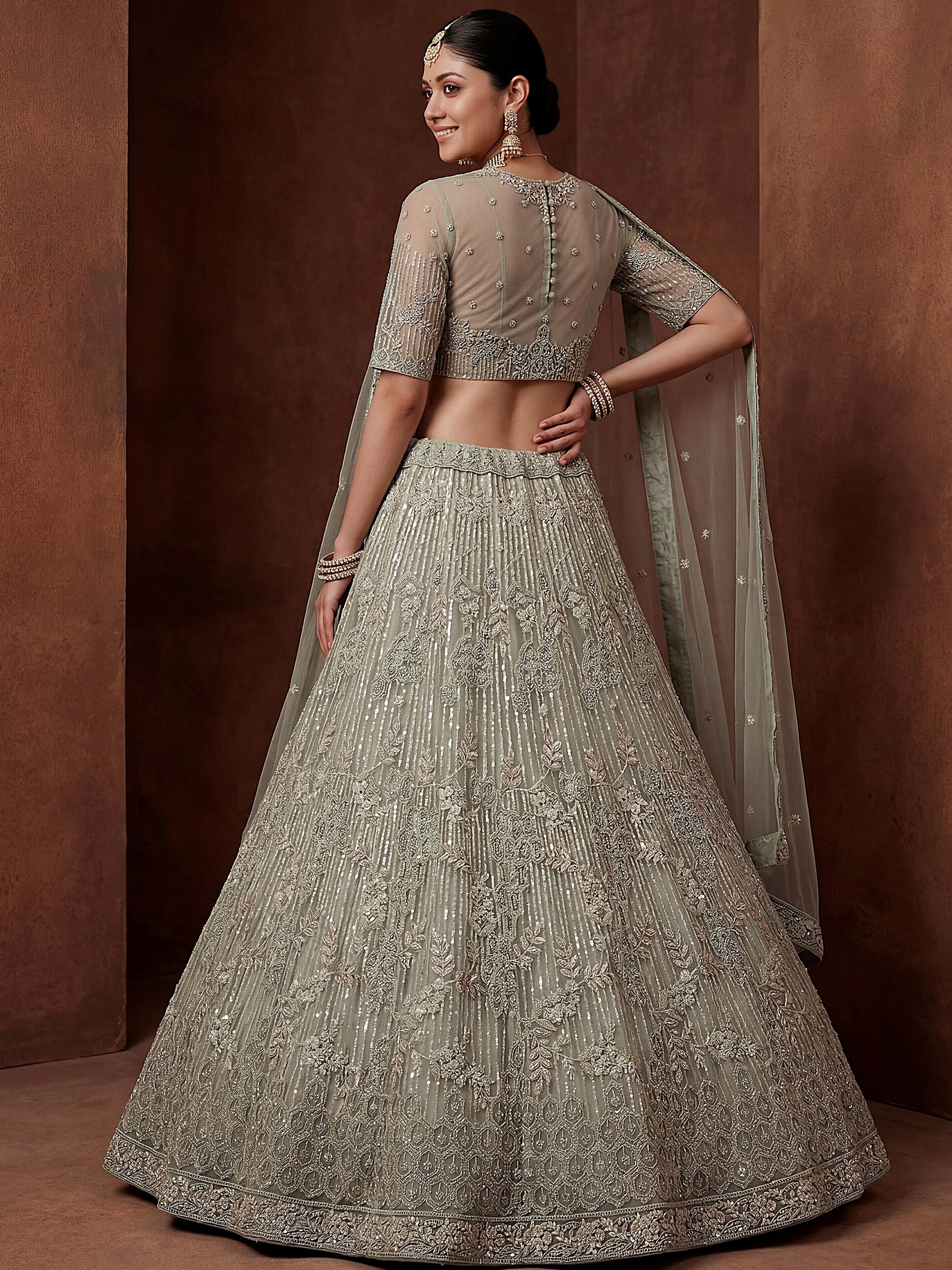 Glowing Pastel Green Diamond Work Net Reception Lehenga Choli