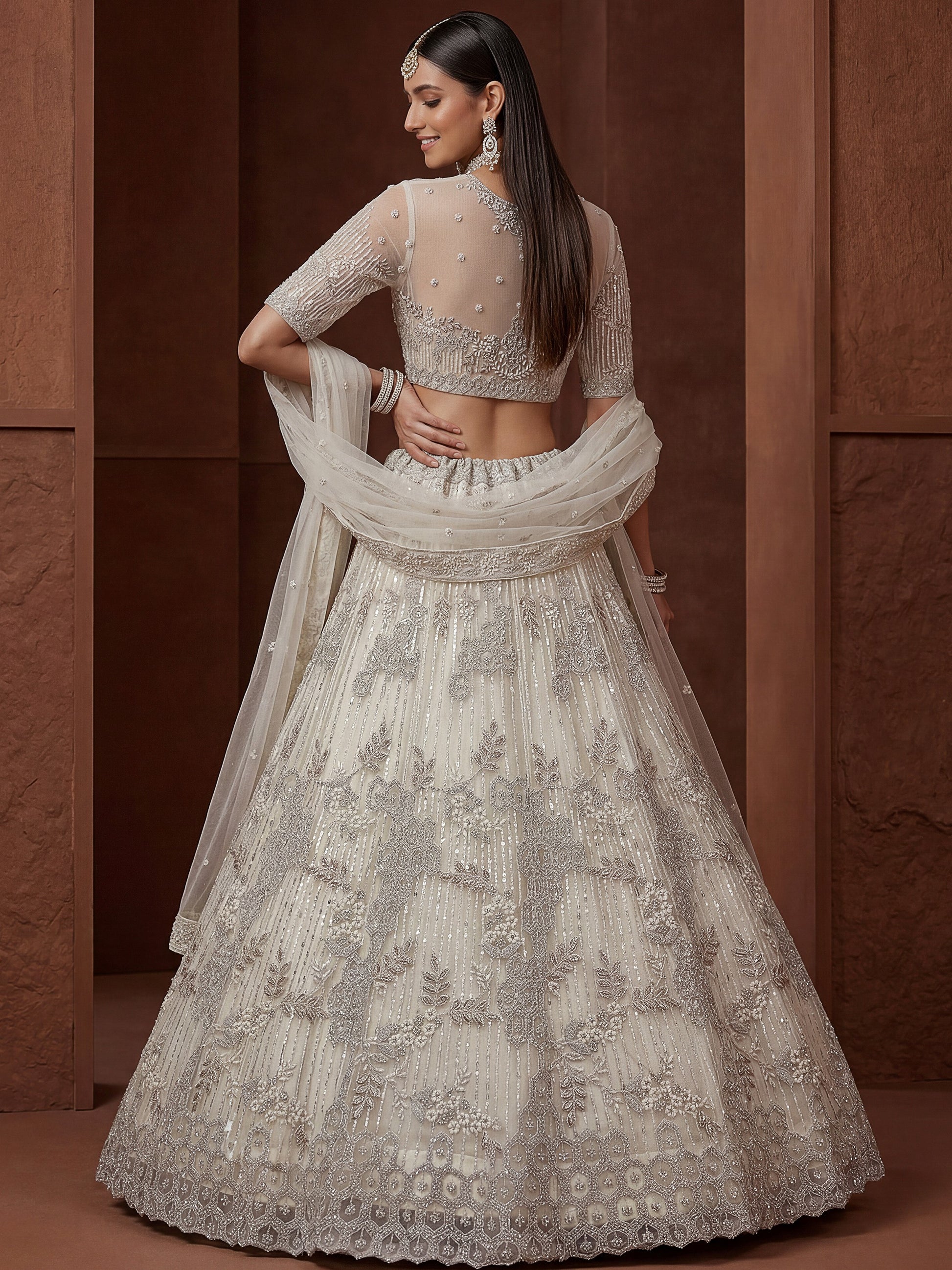 Gorgeous Off-White Zari Embroidered Net Wedding Wear Lehenga Choli