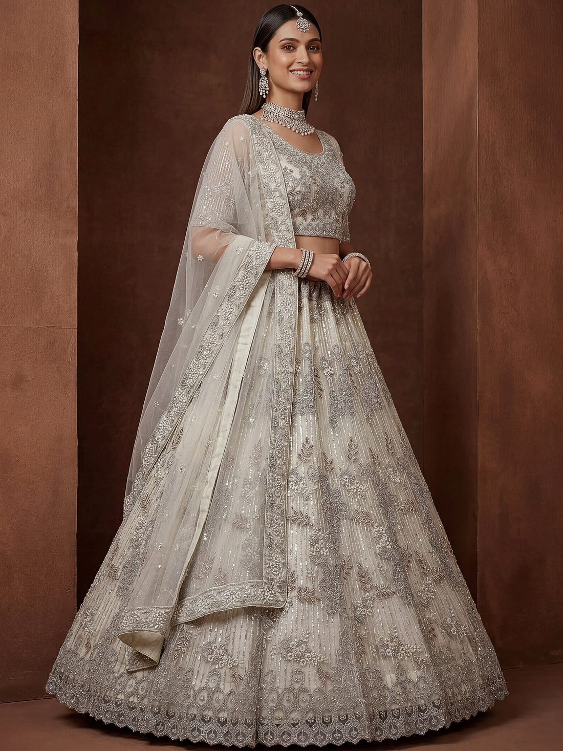 Gorgeous Off-White Zari Embroidered Net Wedding Wear Lehenga Choli