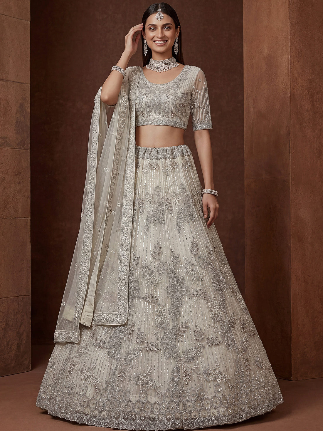 Gorgeous Off-White Zari Embroidered Net Wedding Wear Lehenga Choli