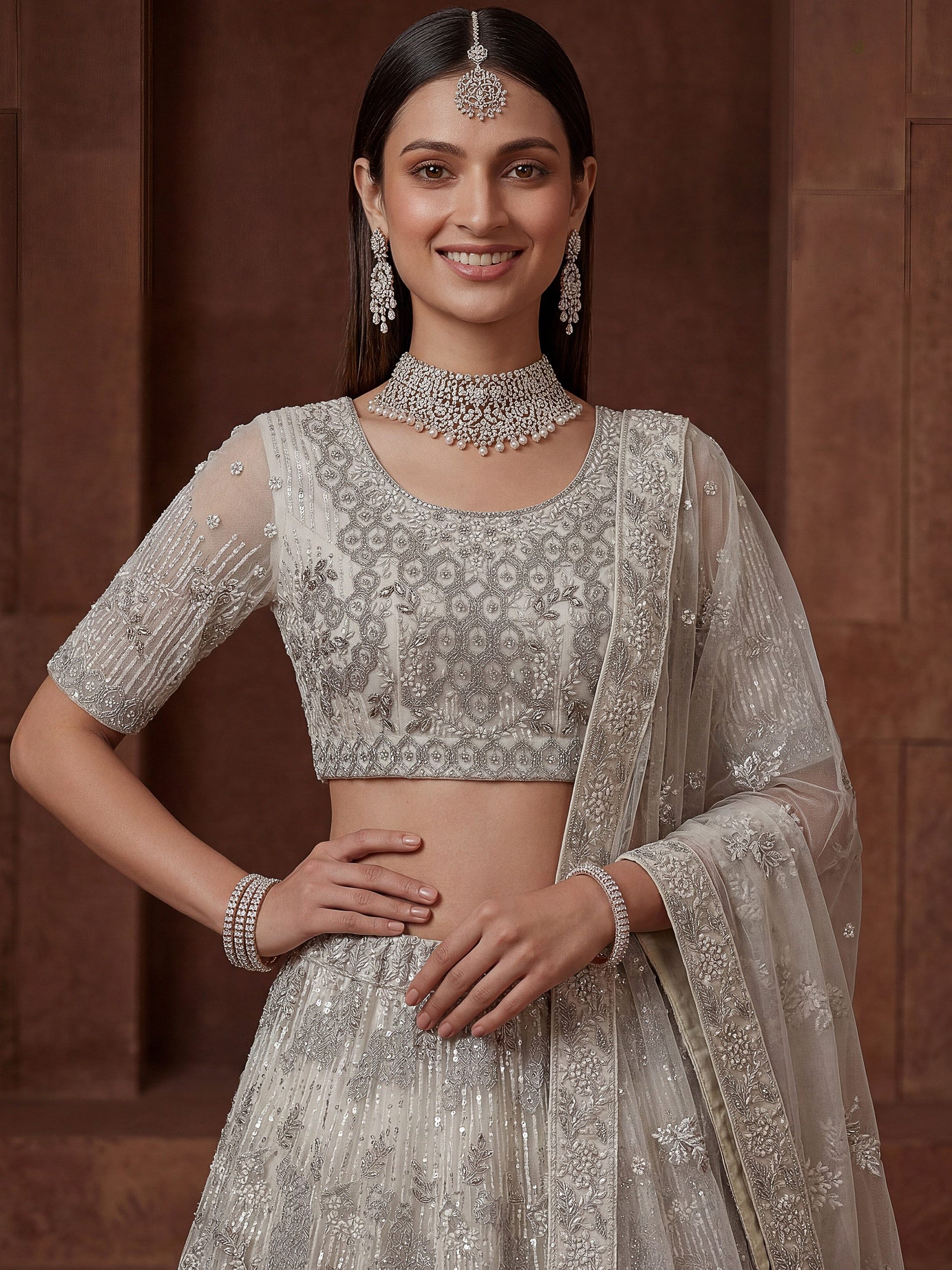 Gorgeous Off-White Zari Embroidered Net Wedding Wear Lehenga Choli