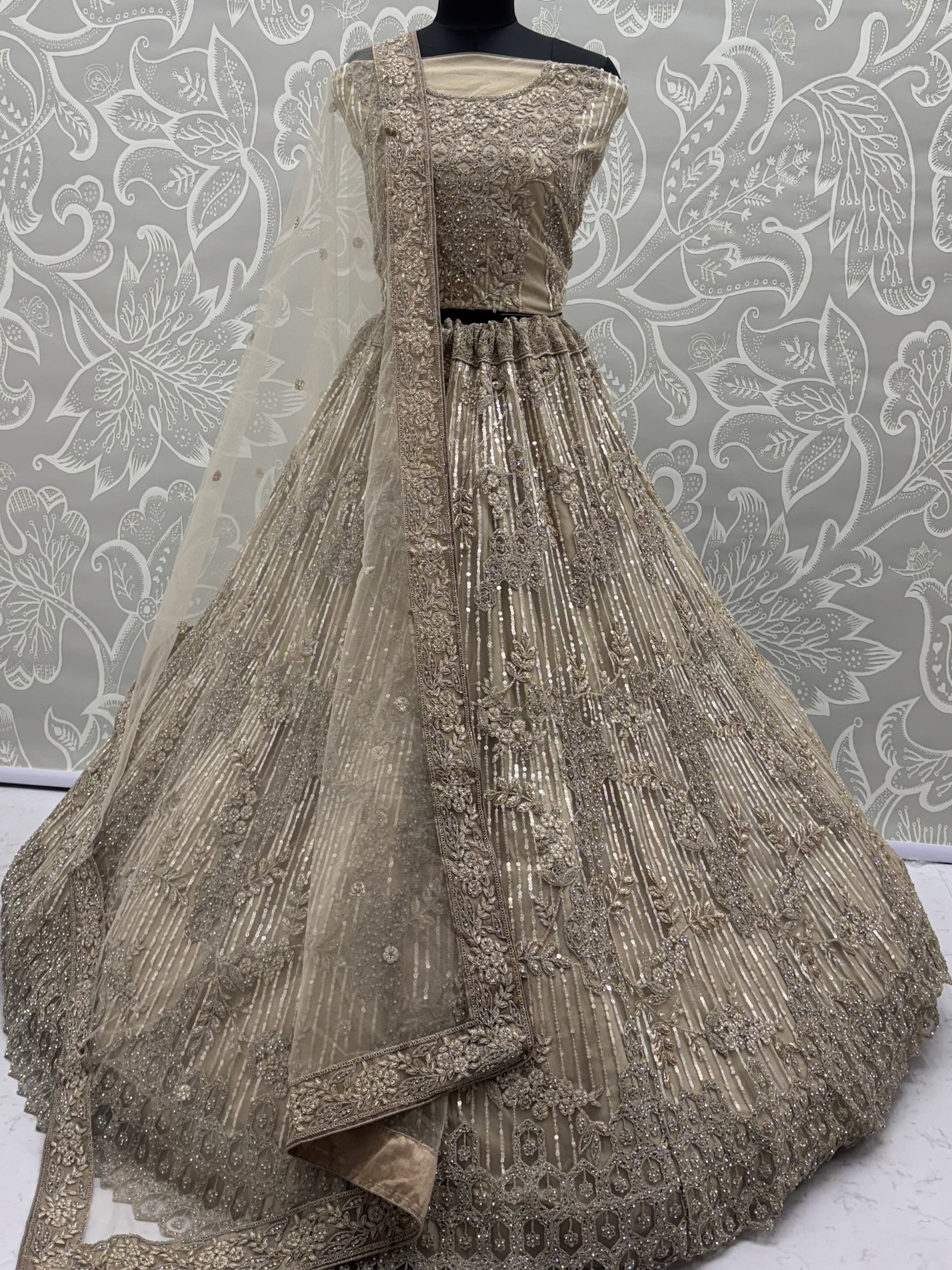Incredible Beige Zari Embroidery Net Wedding Lehenga Choli