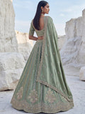 Attractive Pista Green Boota Work  Silk Traditional Wear Lehenga Choli With Dupatta