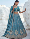 Attractive Teal Blue Embroidered Silk Engagement Wear Lehenga Choli With Dupatta