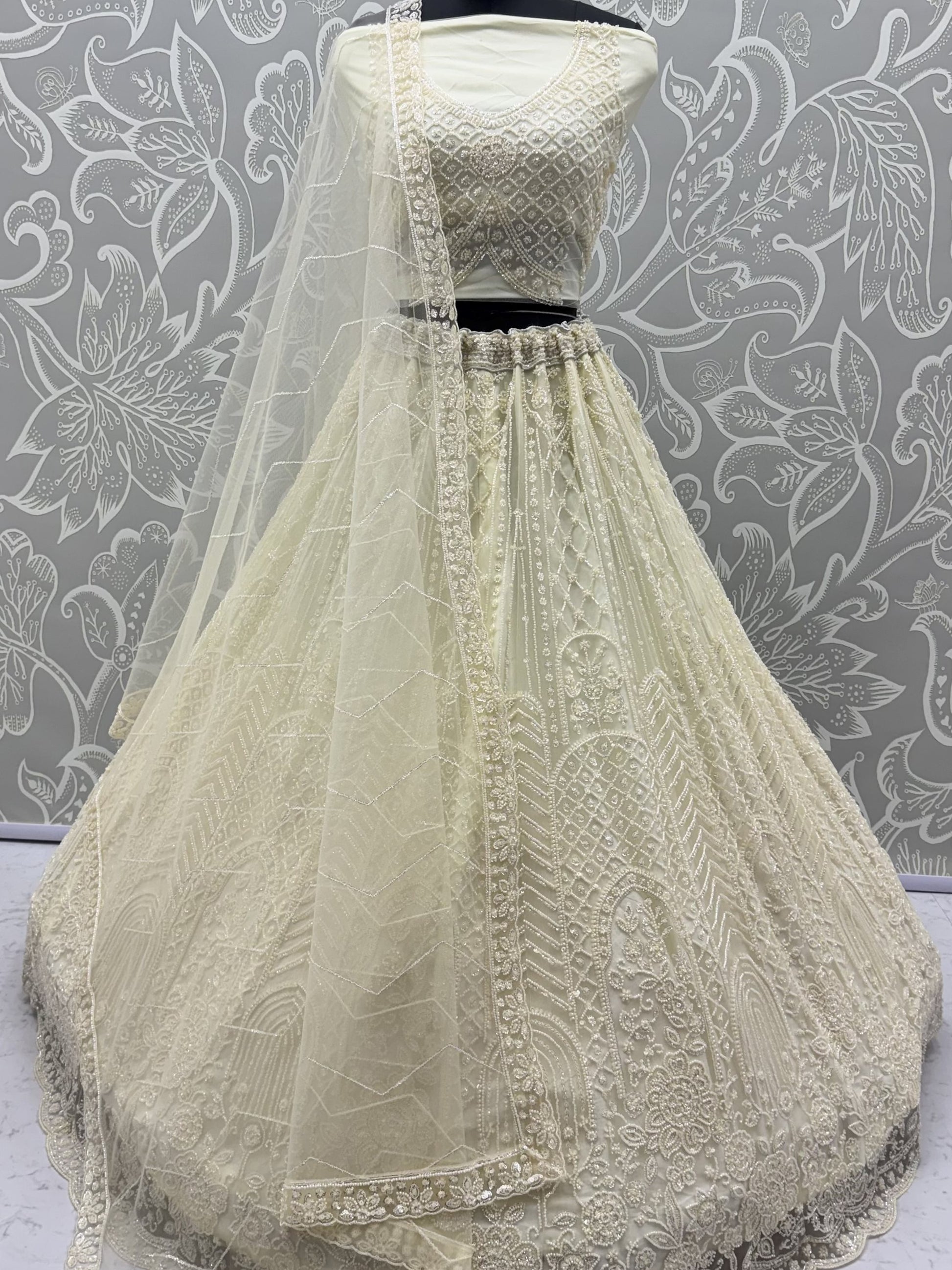 Attractive Off-White Beads Work Net Wedding Wear Lehenga Choli With Dupatta